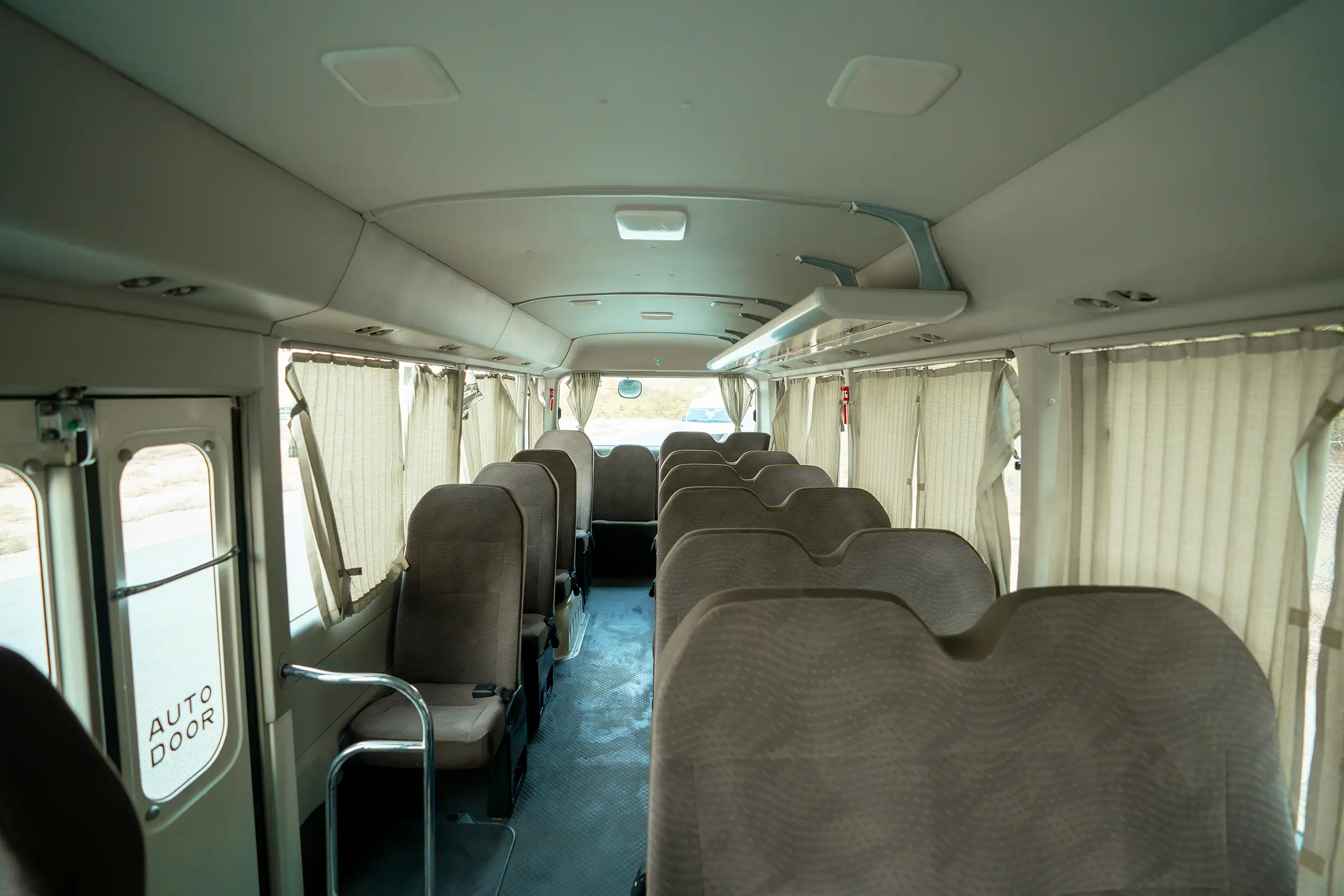 Used 2020 Toyota Coaster High Roof in White – Rear Seat View for Sale at First Choice Cars Dubai Sharjah