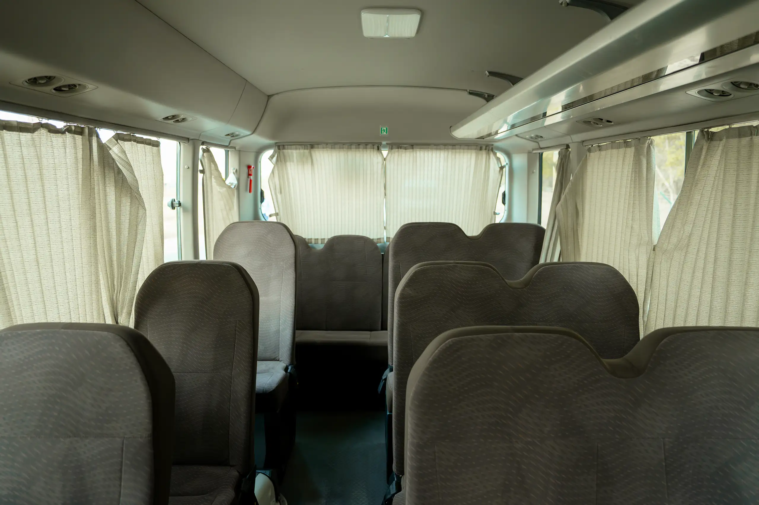 Used 2020 Toyota Coaster High Roof in White – Rear Seat View for Sale at First Choice Cars Dubai Sharjah