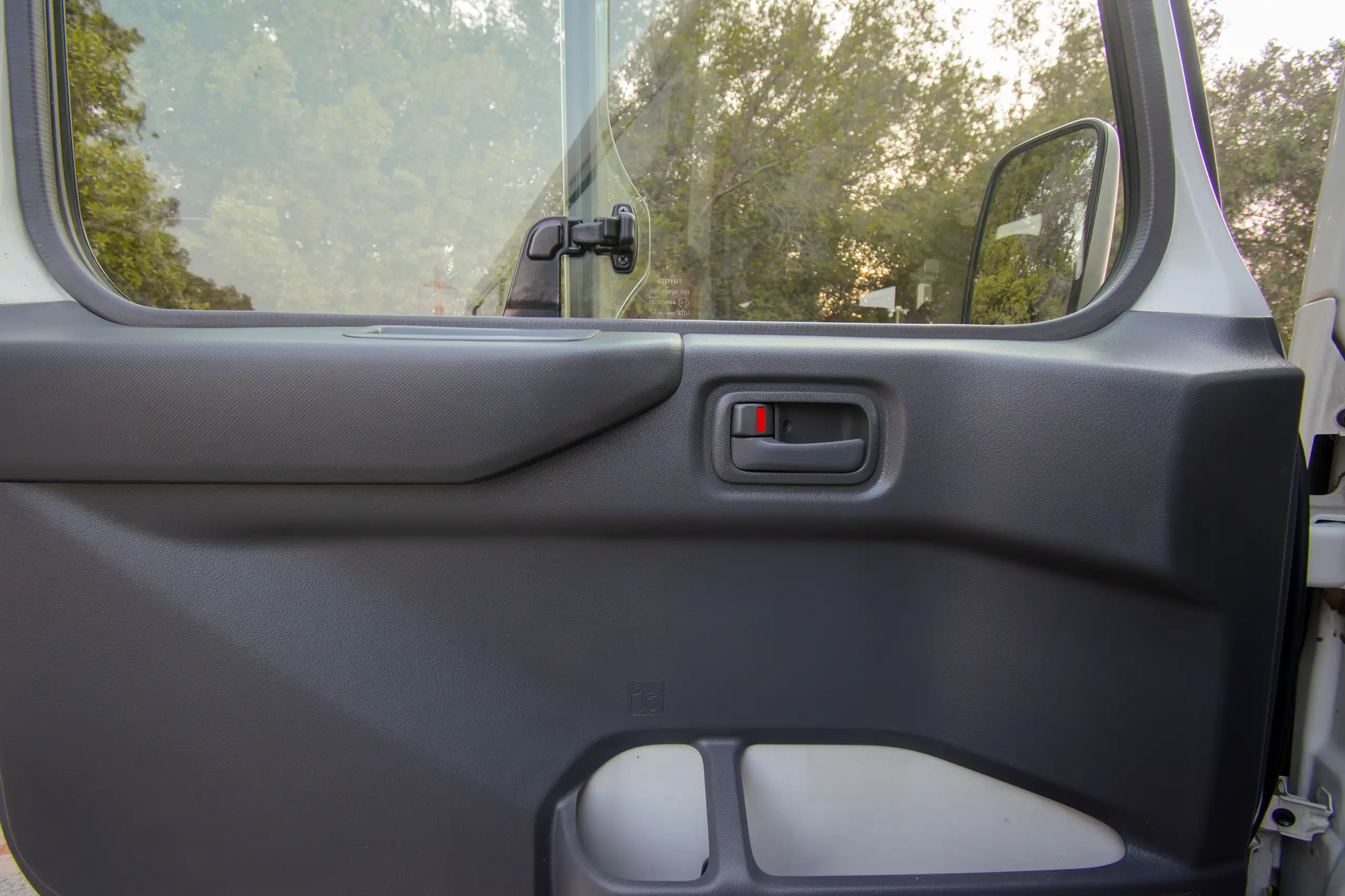 Used 2020 Toyota Coaster High Roof White – Driver Door Panel Full View at First Choice Cars Sharjah