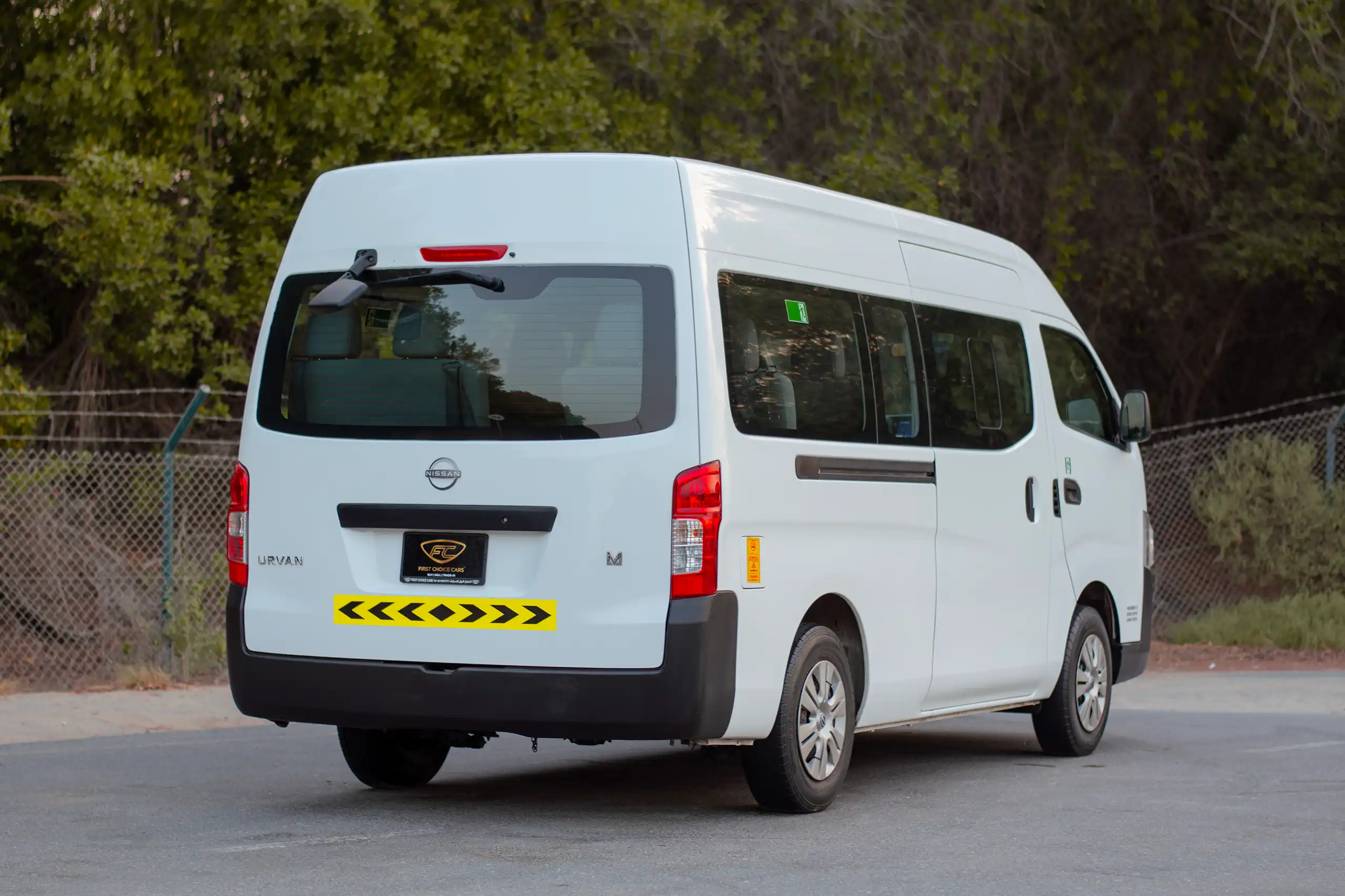Used 2023 Nissan Urvan High Roof in White – Left Back Diagonal (45°) View for Sale at First Choice Cars Dubai Sharjah