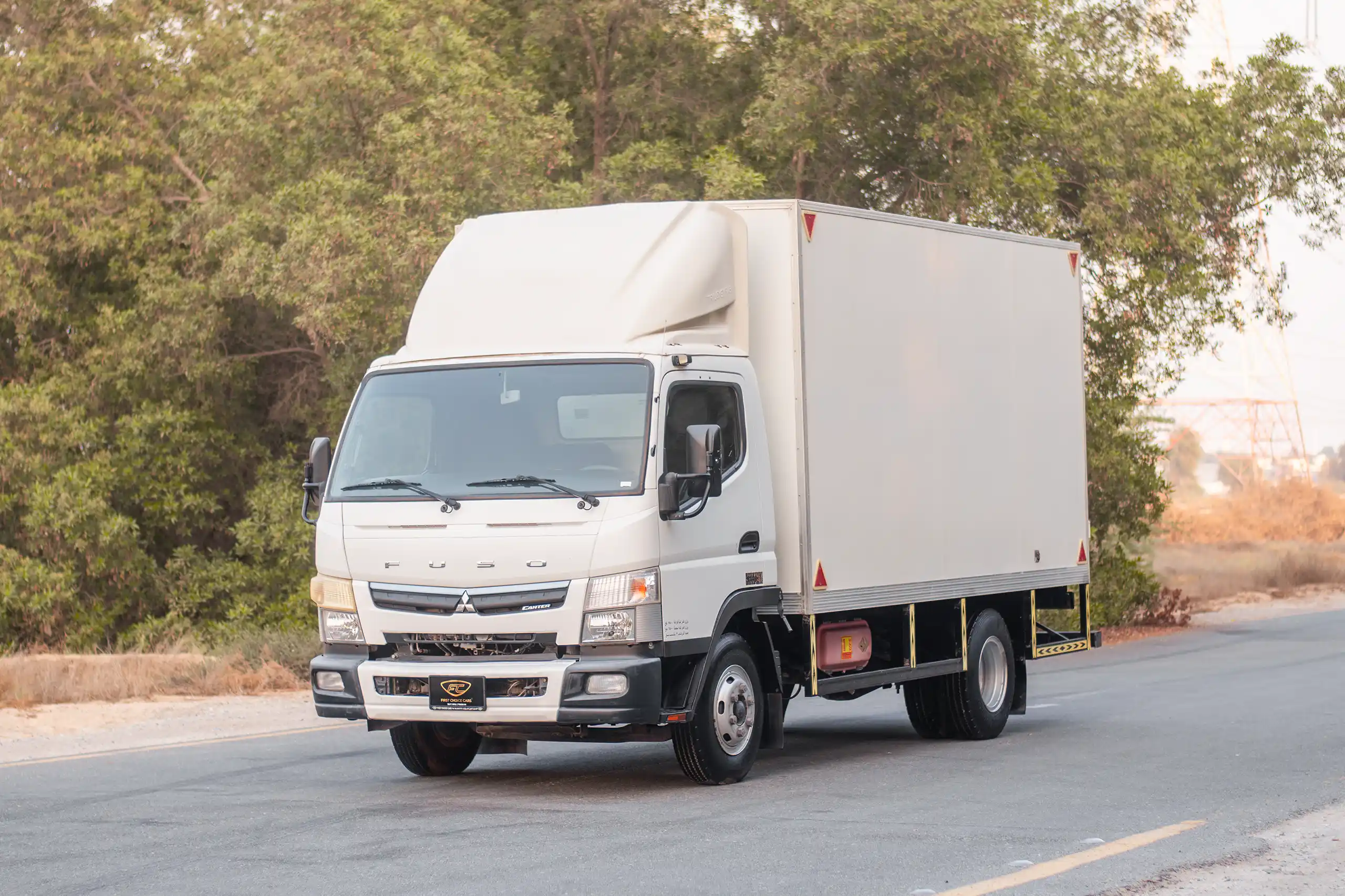 Used 2020 Mitsubishi Canter Cargo Box in White – Left Front Diagonal (45°) View for Sale at First Choice Cars Dubai Sharjah