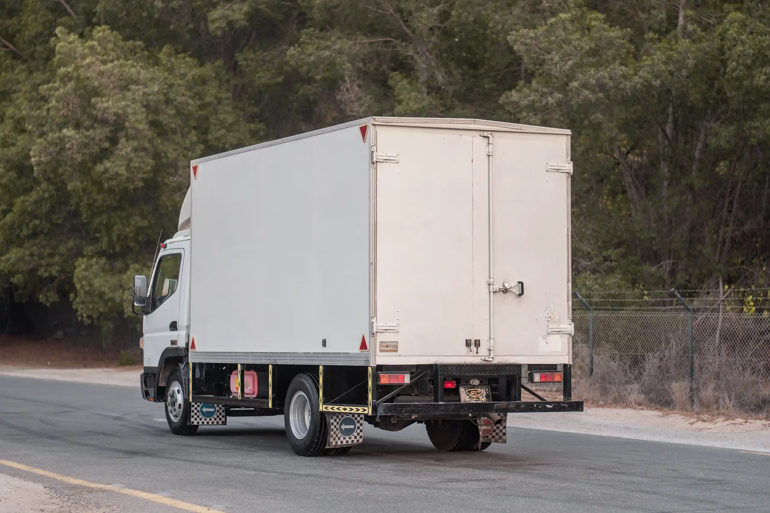 Used 2020 Mitsubishi Canter Cargo Box in White – Left Back Diagonal (45°) View for Sale at First Choice Cars Dubai Sharjah