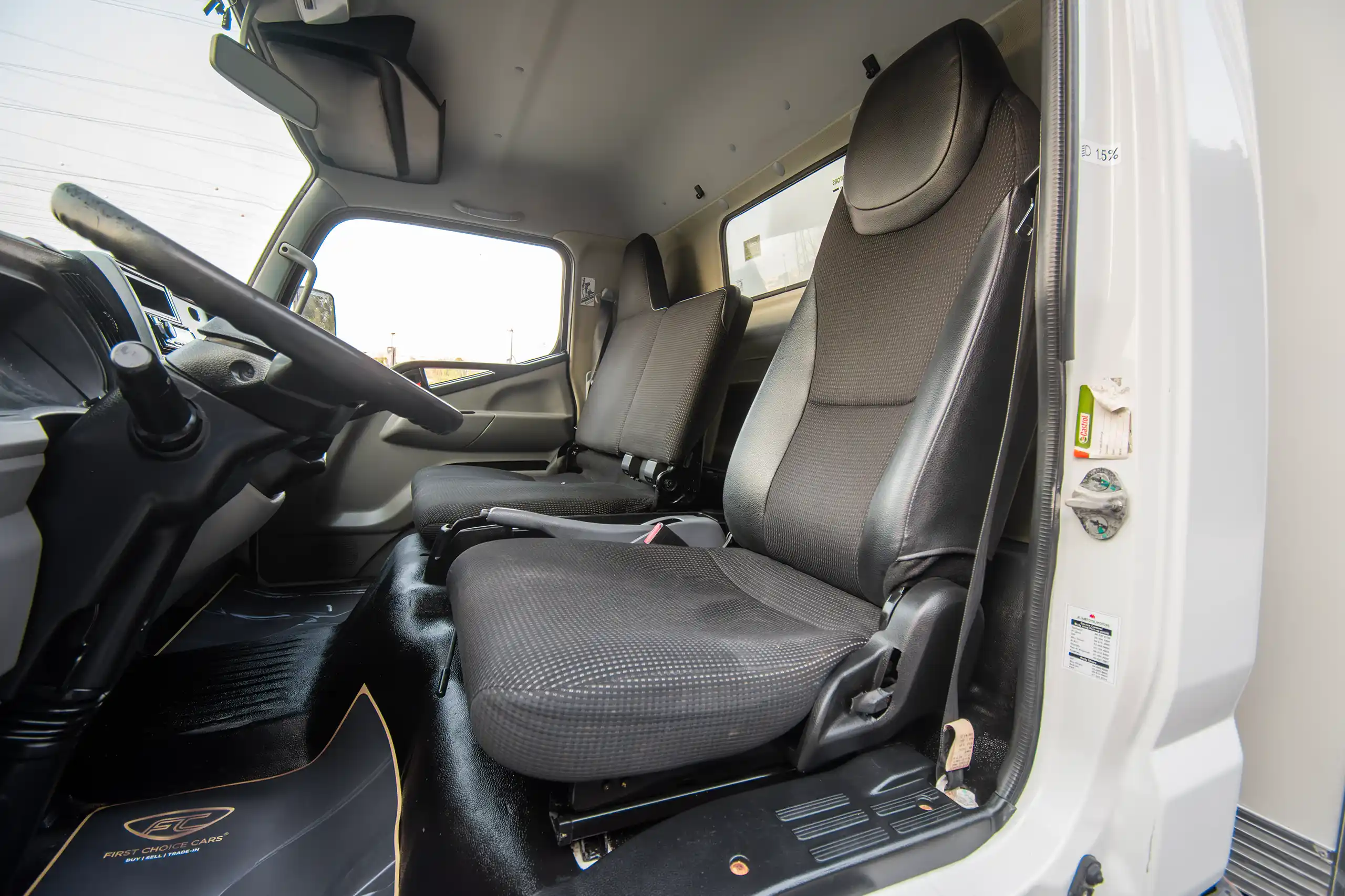 Used 2020 Mitsubishi Canter Cargo Box in White – Front Driver Side Cabin View for Sale at First Choice Cars Dubai Sharjah