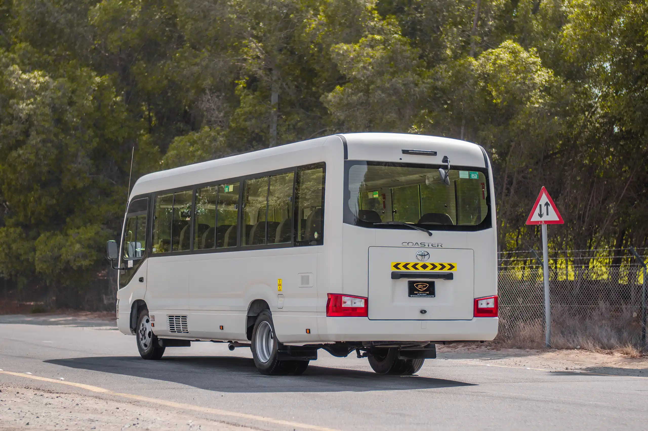 Used 2020 Toyota Coaster High Roof in White – Left Back Diagonal (45°) View