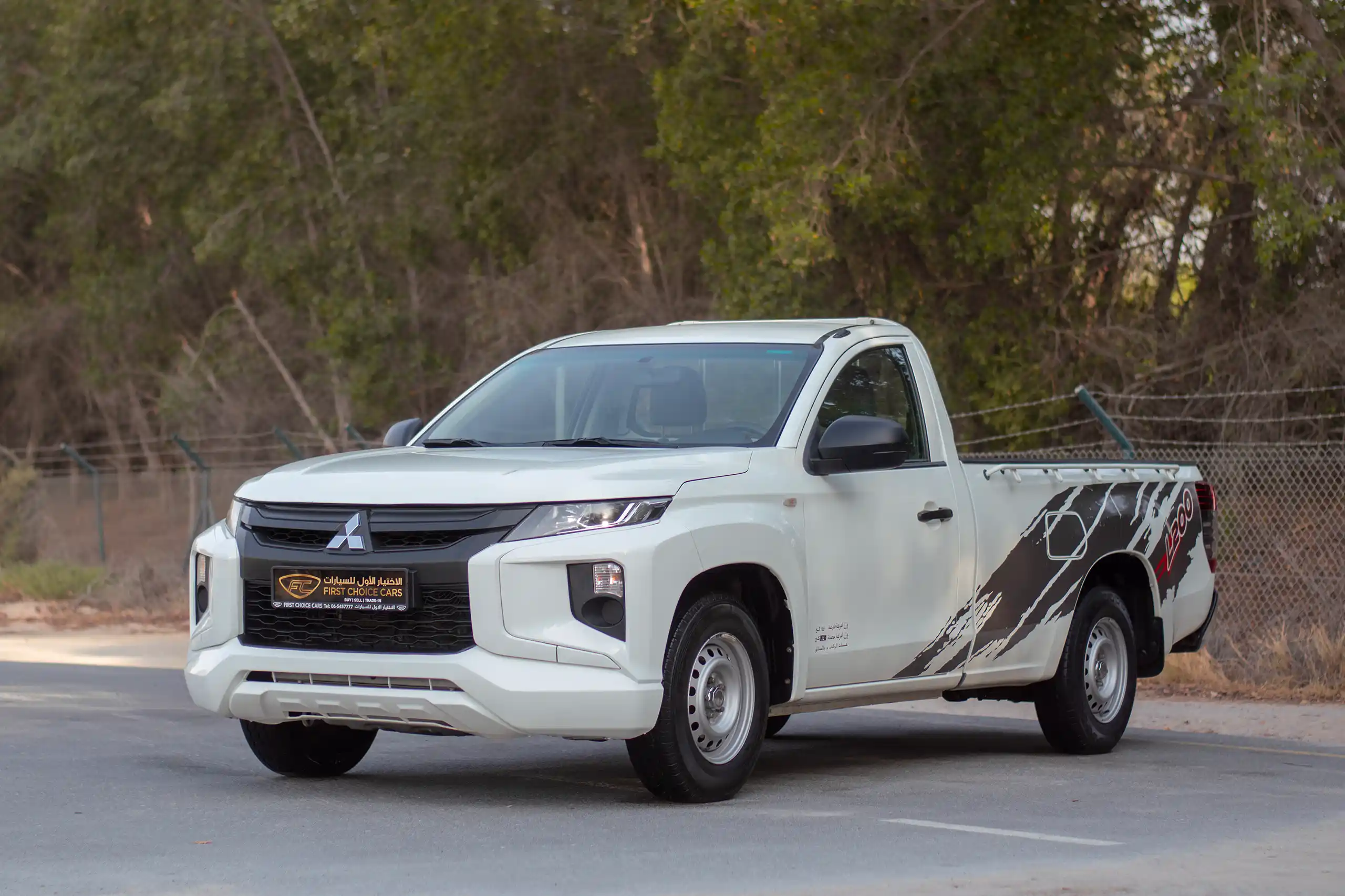 Used 2021 Mitsubishi L200 GL Single Cabin in White – Left Front Diagonal (45°) View for Sale at First Choice Cars Dubai Sharjah