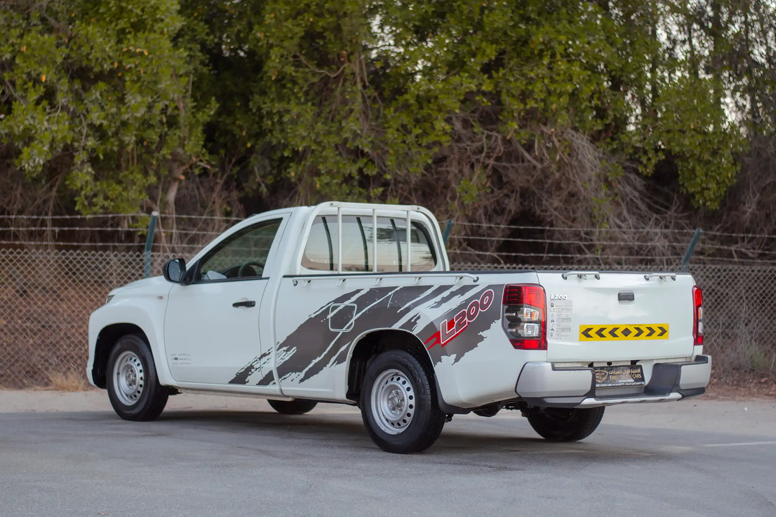 Used 2021 Mitsubishi L200 GL Single Cabin in White – Left Back Diagonal (45°) View for Sale at First Choice Cars Dubai Sharjah