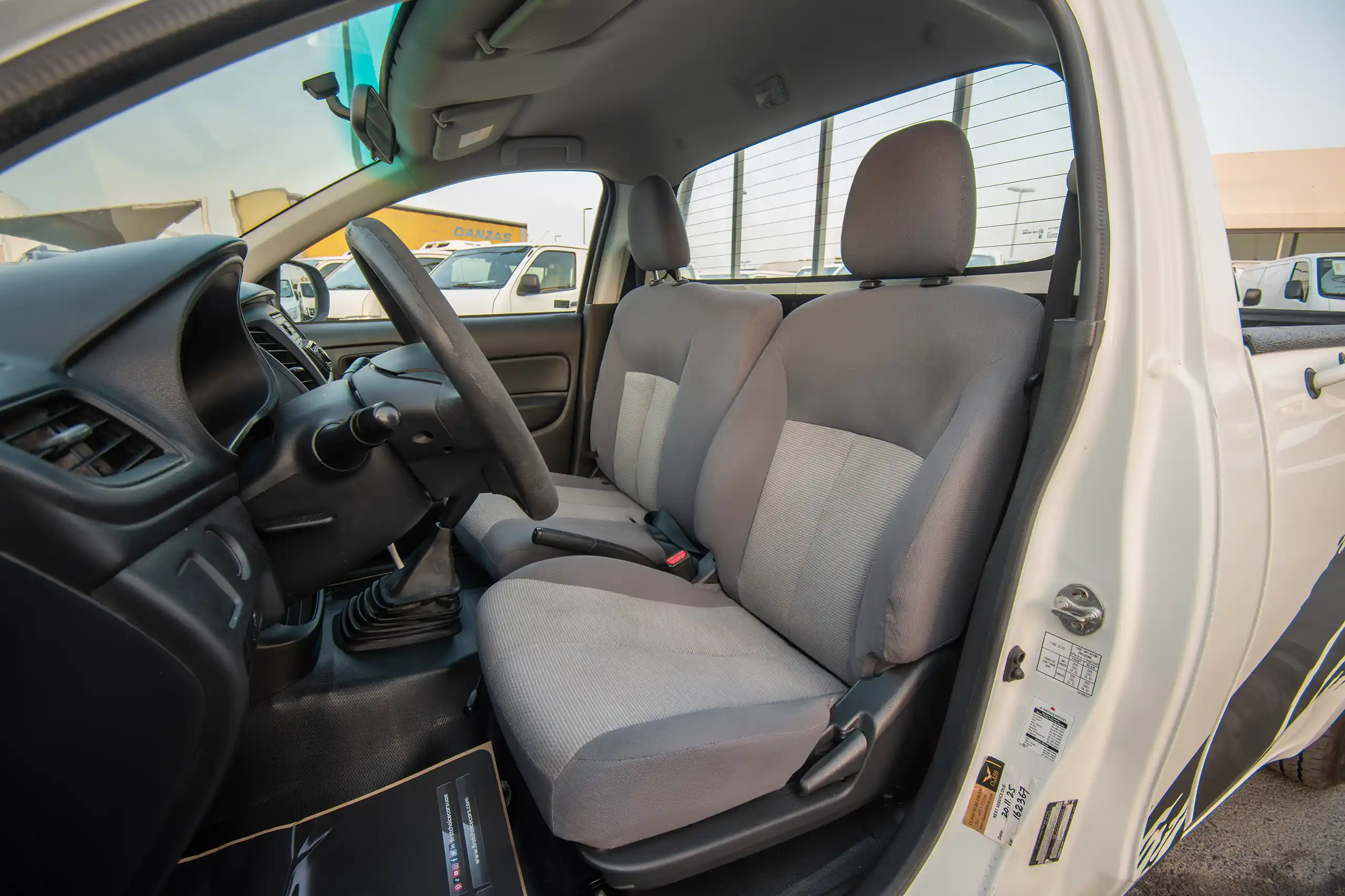 Used 2021 Mitsubishi L200 GL Single Cabin in White – Front Driver Side Cabin View for Sale at First Choice Cars Dubai Sharjah