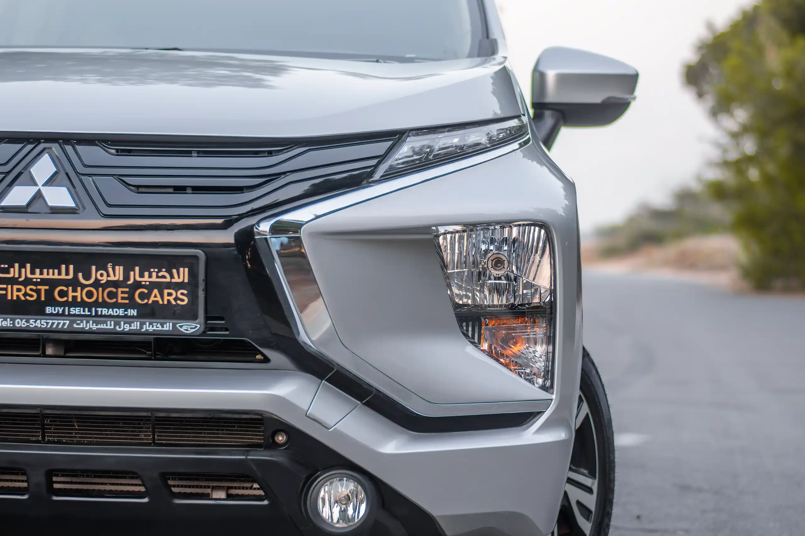 Used 2022 Mitsubishi Xpander GLS Silver – Headlight Close-up at First Choice Cars Sharjah