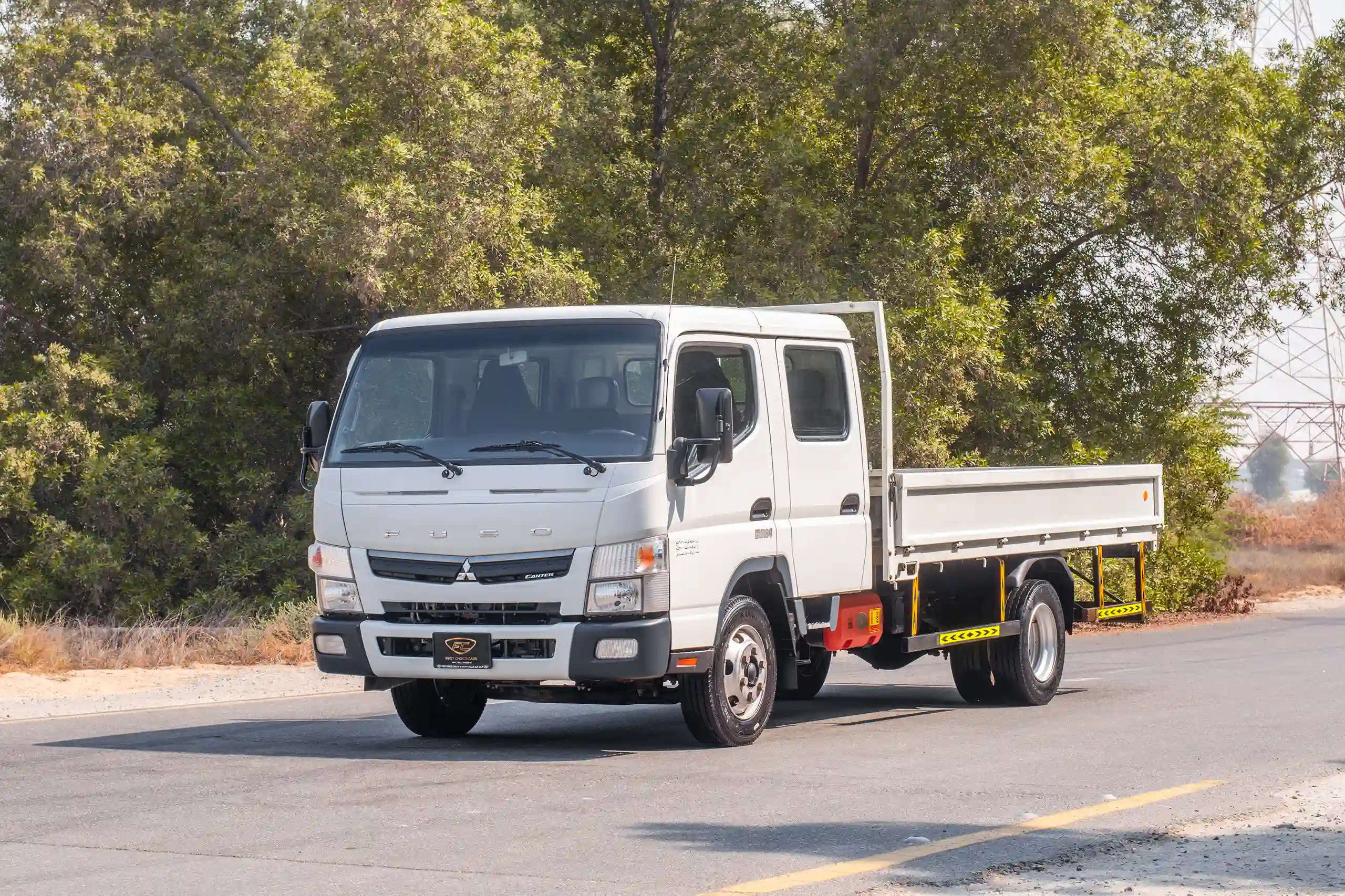 Used 2023 Mitsubishi Canter Double Cabin Cargo Body White – Left Front Diagonal (45°) View at First Choice Cars Sharjah