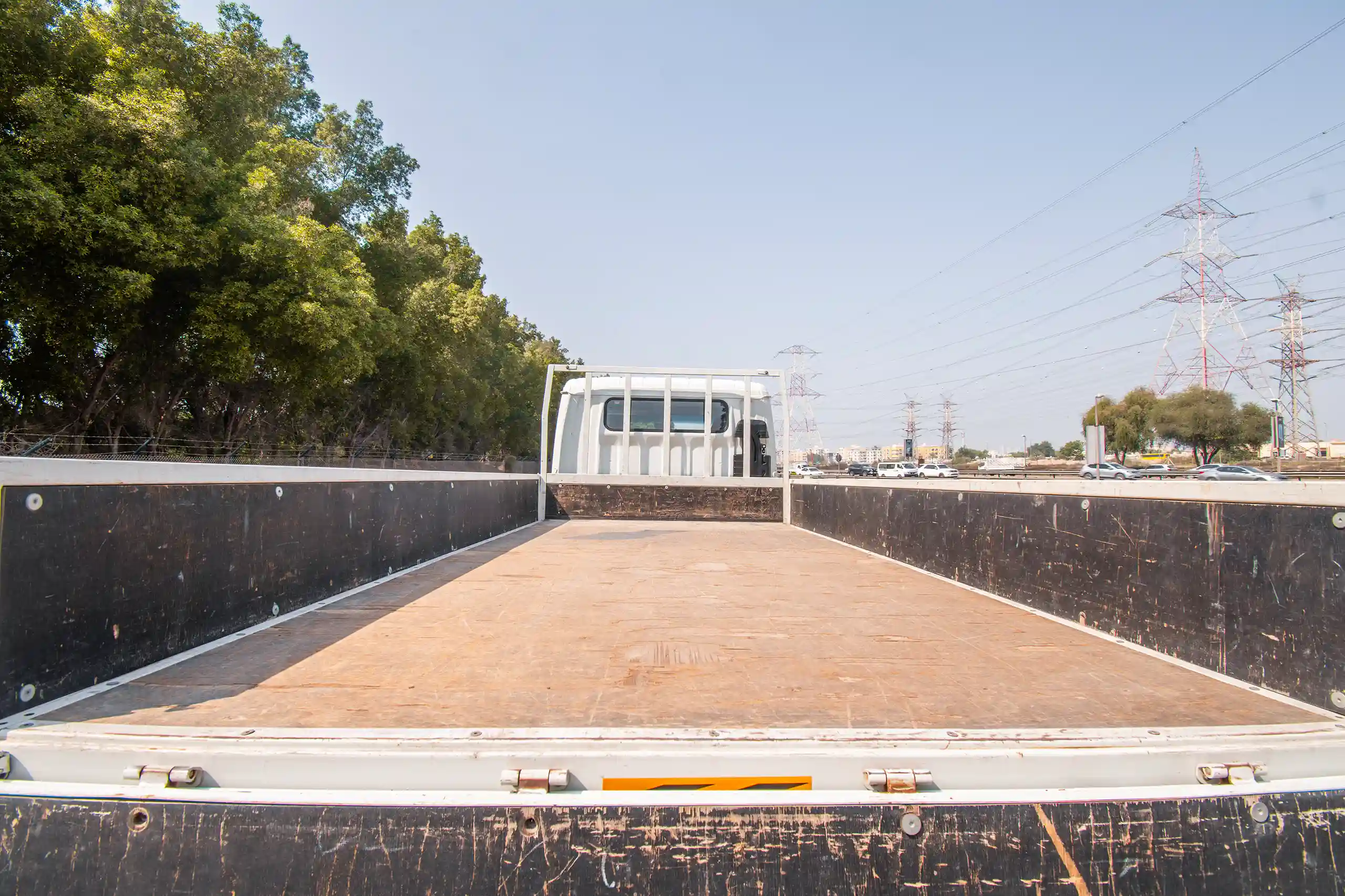 Used 2023 Mitsubishi Canter Double Cabin Cargo Body White – Cargo Bed Rear-to-Front View at First Choice Cars Sharjah