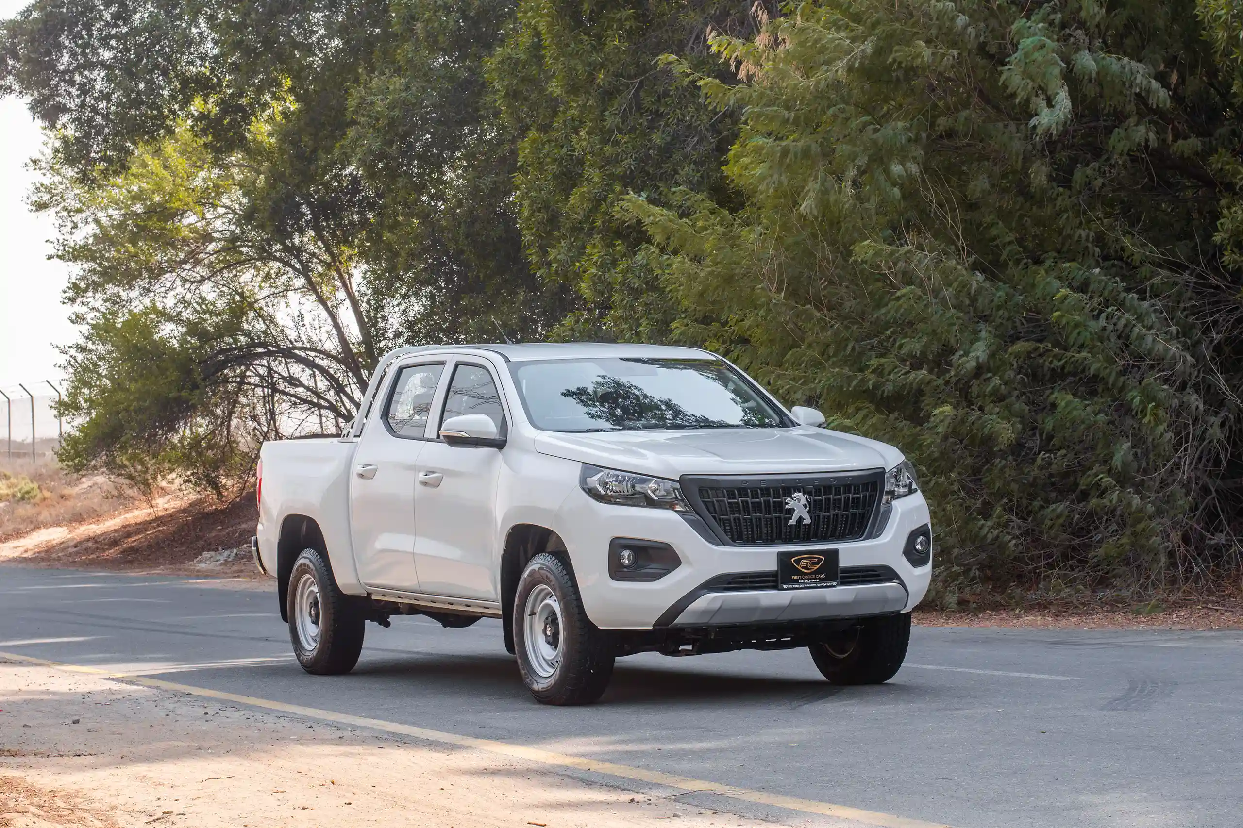 Used 2023 Peugeot Landtrek Double Cabin White – Right Front Diagonal (45°) View at First Choice Cars Sharjah