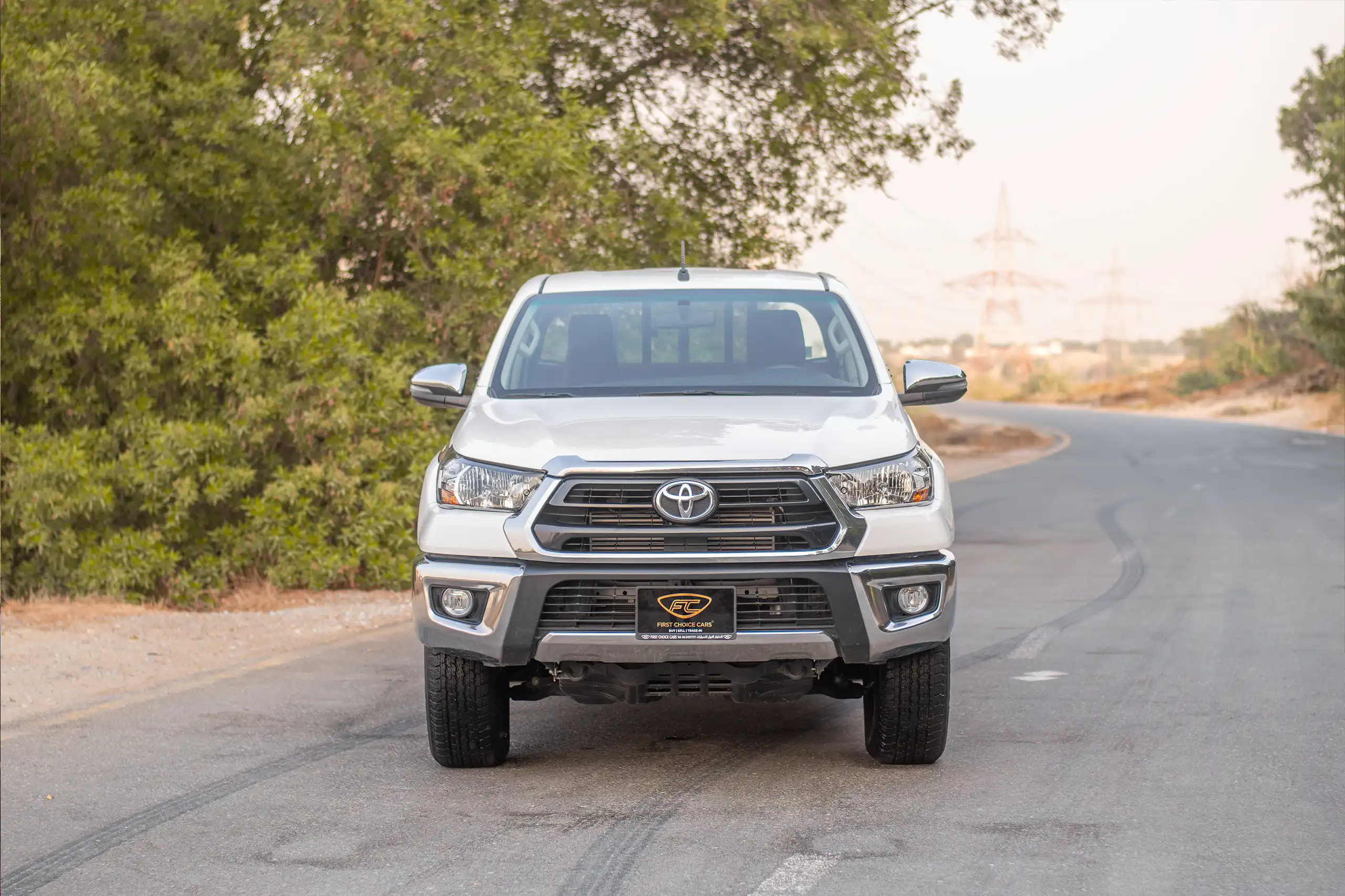 Used 2024 Toyota Hilux DLX Double Cabin in White – Front View for Sale at First Choice Cars Dubai Sharjah