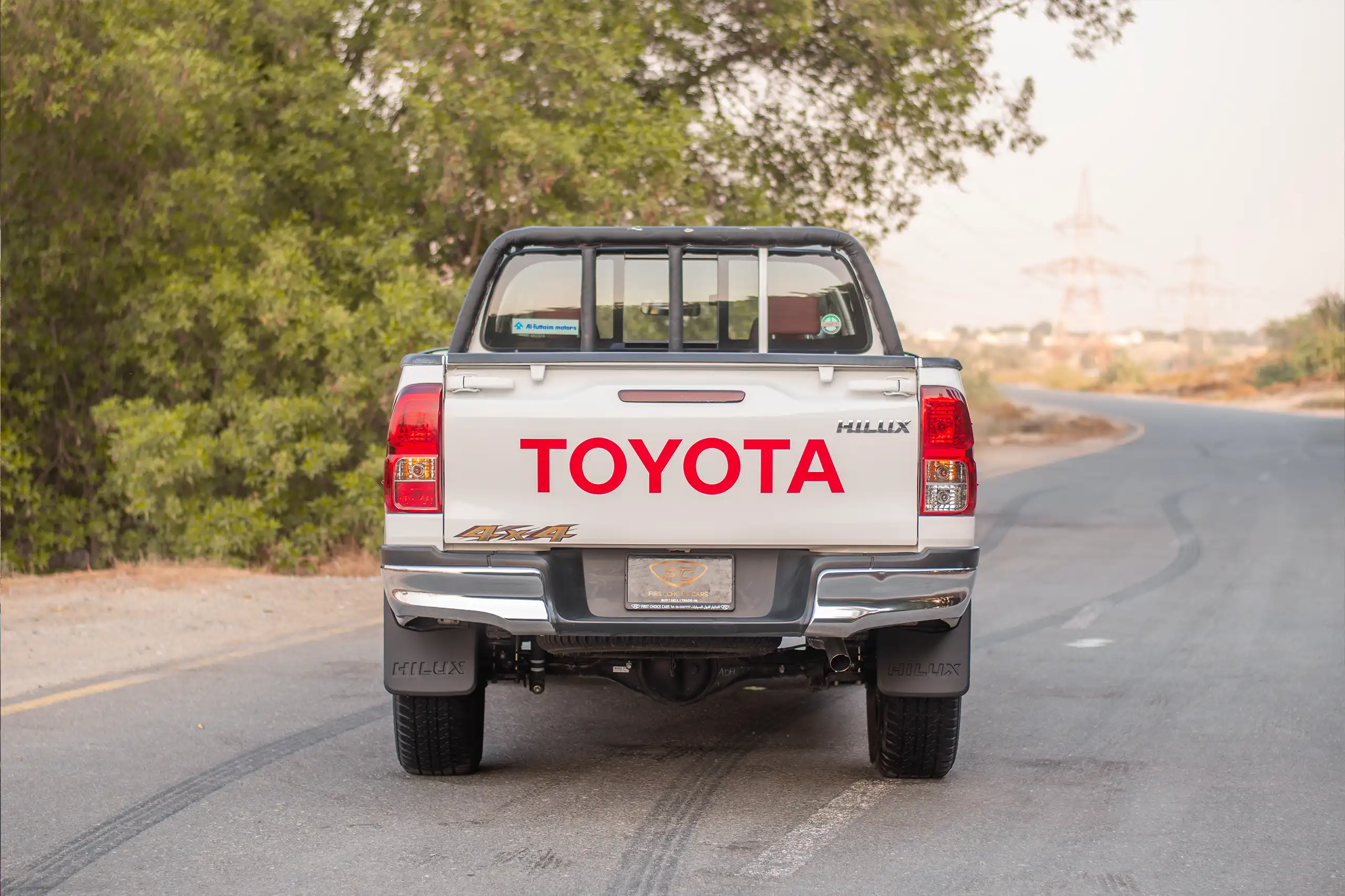 Used 2024 Toyota Hilux DLX Double Cabin in White – Back/Rear View for Sale at First Choice Cars Dubai Sharjah
