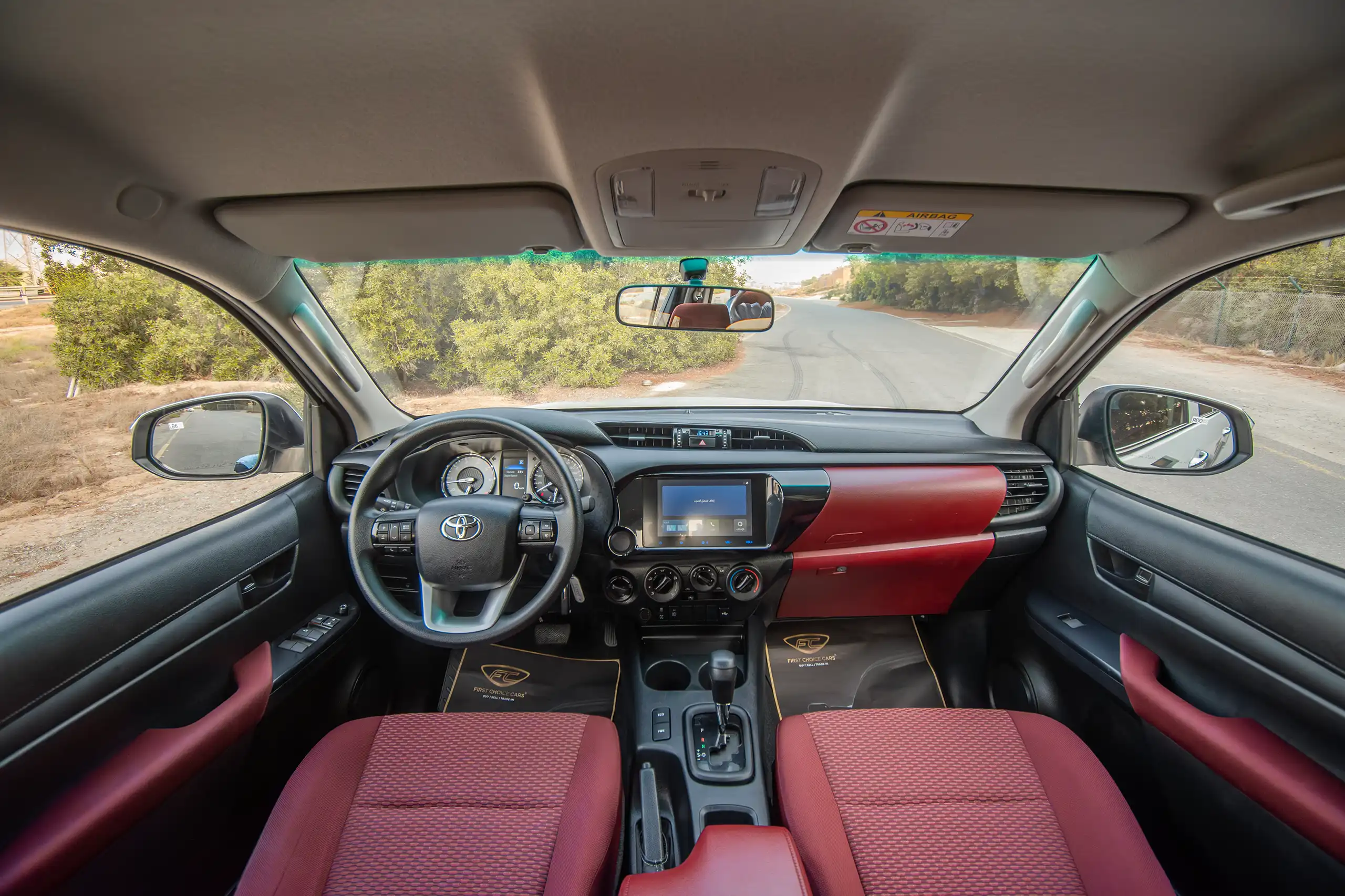 Used 2024 Toyota Hilux DLX Double Cabin in White – Front Cabin / Dashboard Full View for Sale at First Choice Cars Dubai Sharjah