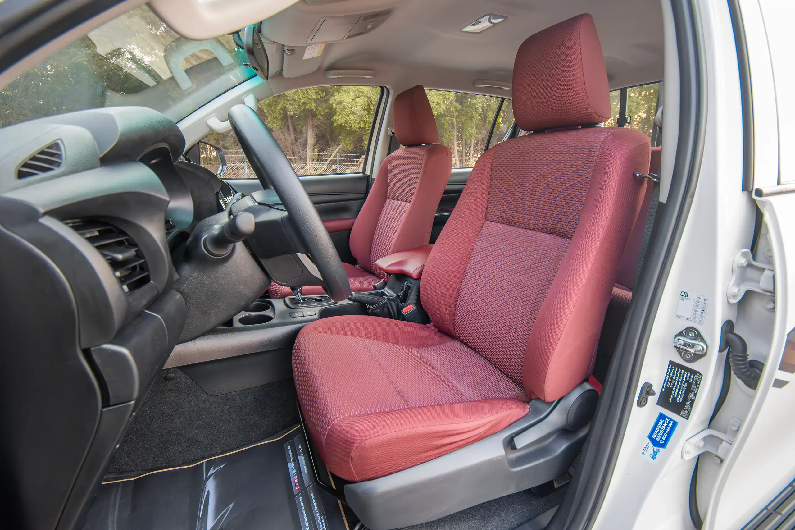 Used 2024 Toyota Hilux DLX Double Cabin in White – Front Driver Side Cabin View for Sale at First Choice Cars Dubai Sharjah