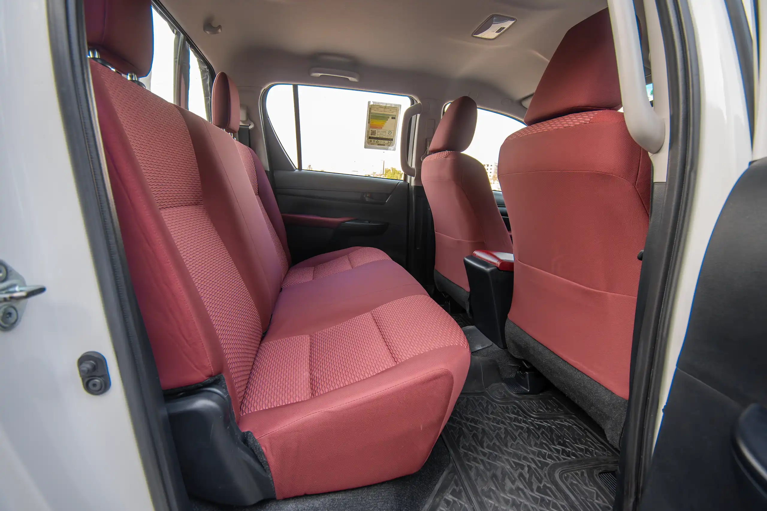 Used 2024 Toyota Hilux DLX Double Cabin in White – Rear Driver Side Cabin View for Sale at First Choice Cars Dubai Sharjah