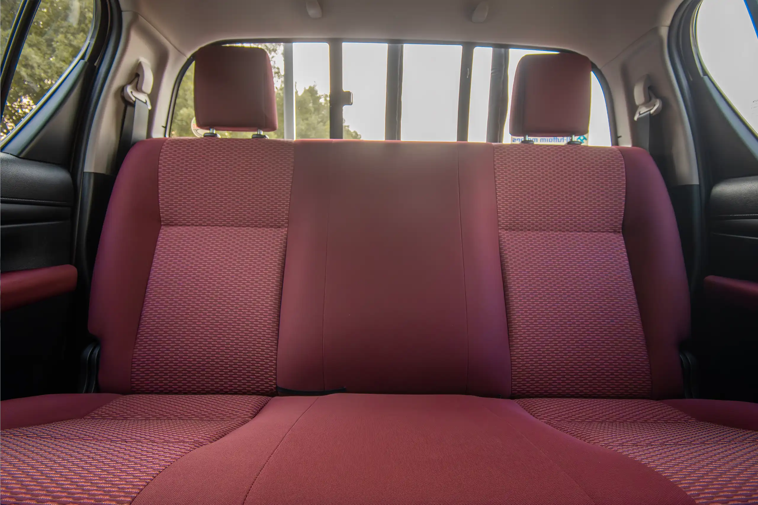 Used 2024 Toyota Hilux DLX Double Cabin in White – Rear Seat View for Sale at First Choice Cars Dubai Sharjah