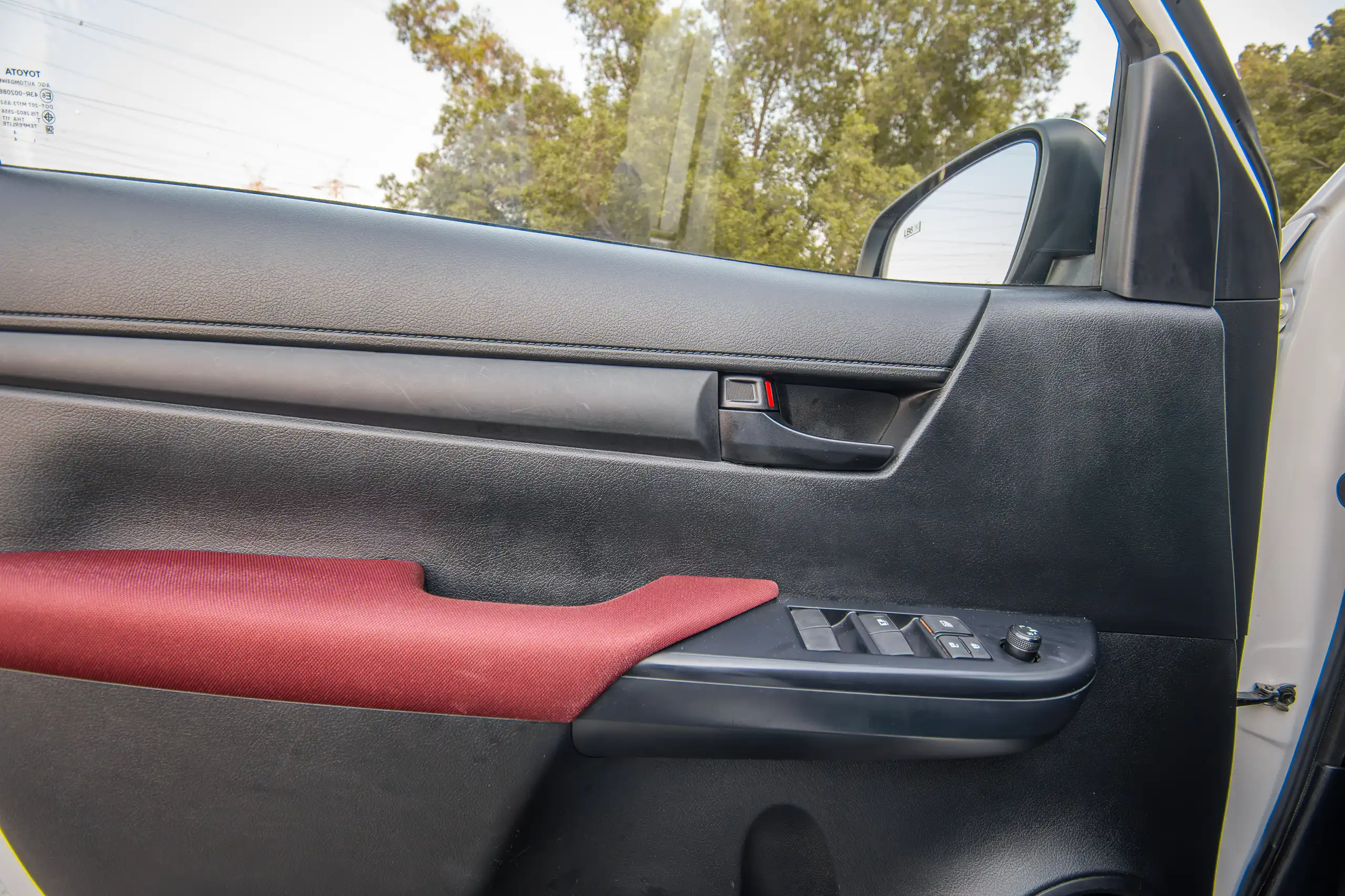 Used 2024 Toyota Hilux DLX Double Cabin in White – Driver Door Panel Full View for Sale at First Choice Cars Dubai Sharjah