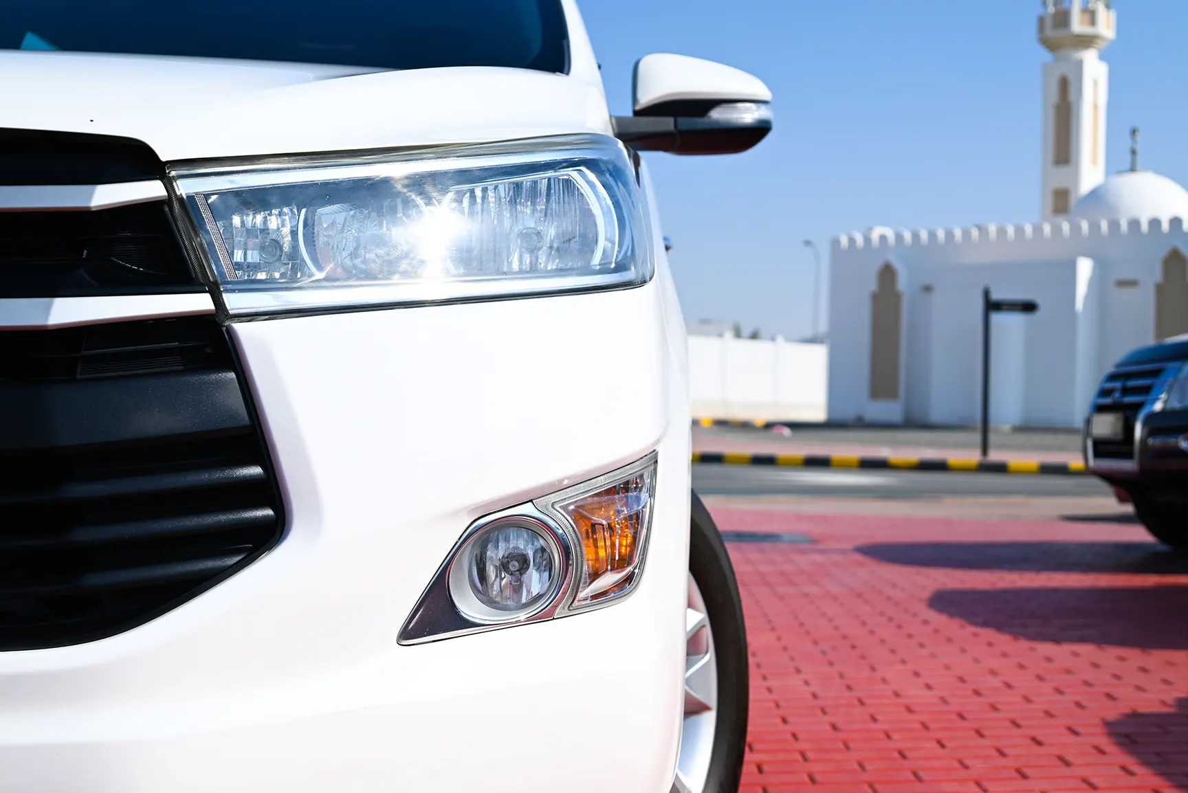 Used 2019 Toyota Innova SE White – Headlight Close-up at First Choice Cars Sharjah