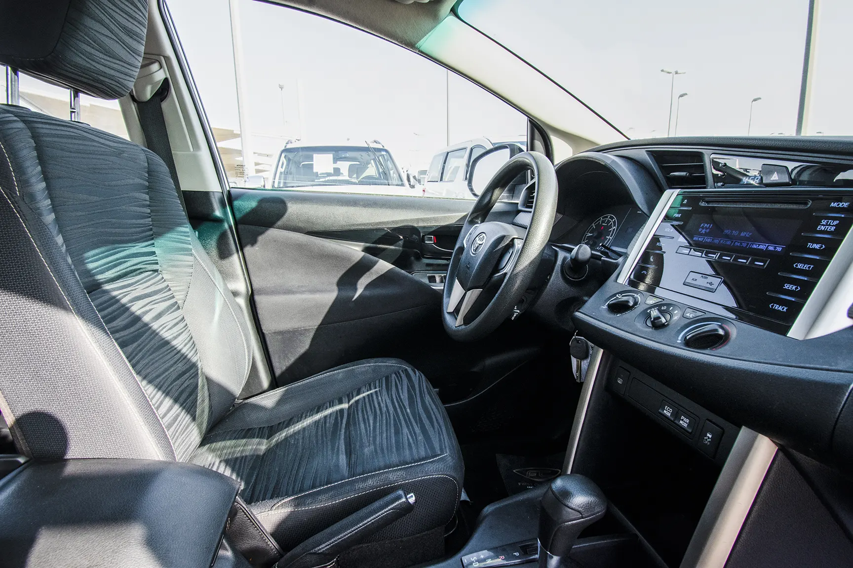 Used 2019 Toyota Innova SE White – Driver Side Dashboard & Steering View at First Choice Cars Sharjah