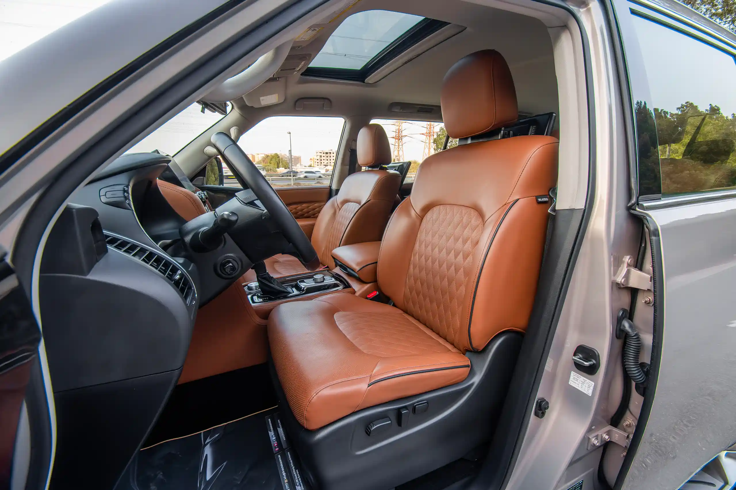 Used 2023 Infiniti QX80 Luxury Grey – Front Driver Side Cabin View at First Choice Cars Sharjah