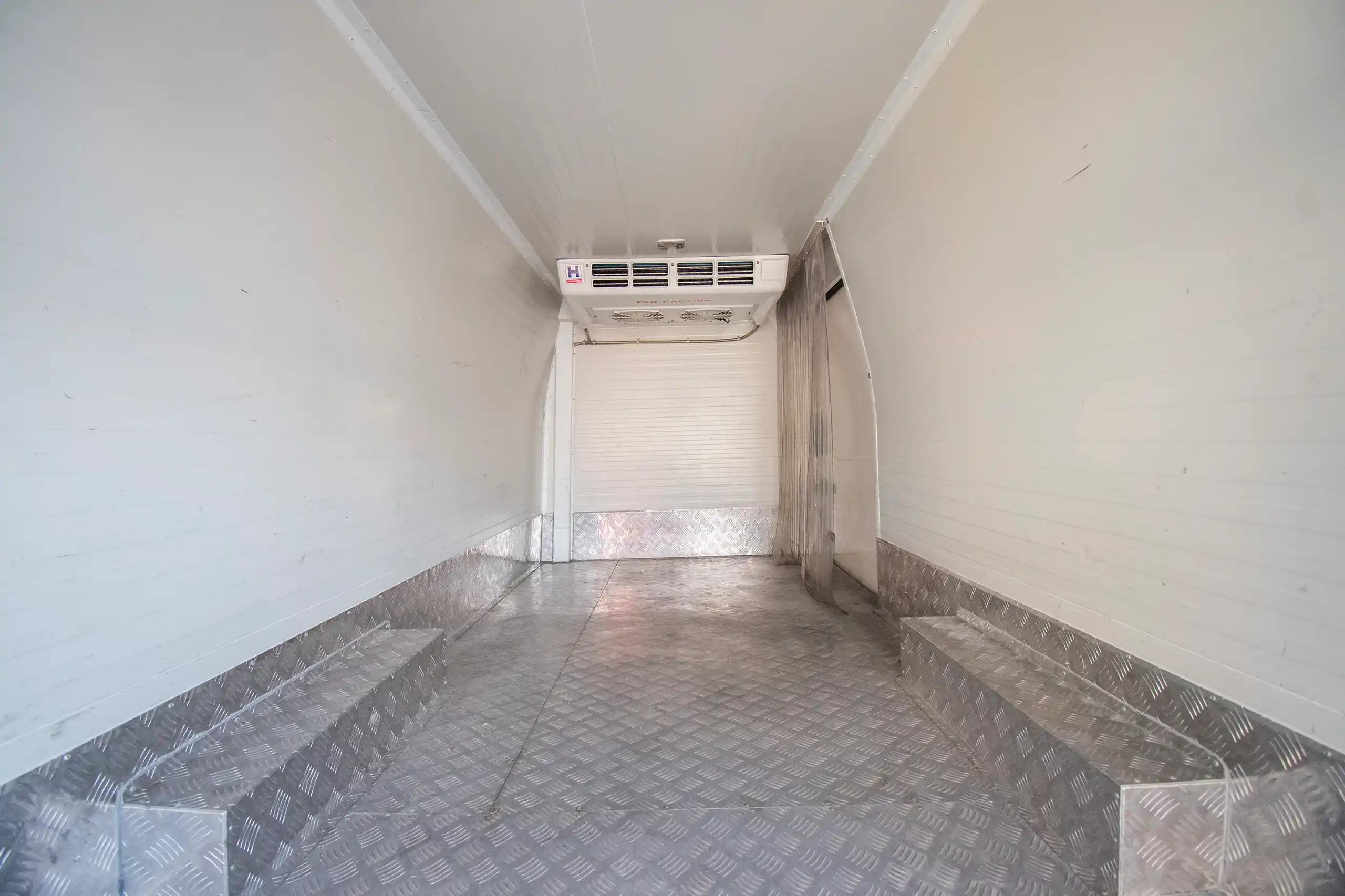 Used 2023 Nissan Urvan High Roof White – Chiller Box Rear Opening View at First Choice Cars Sharjah