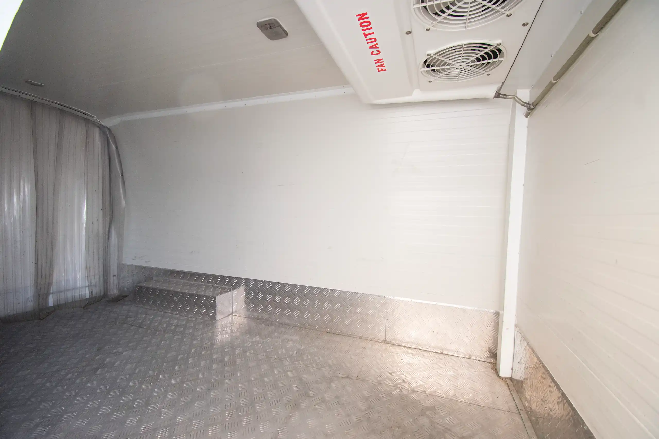 Used 2023 Nissan Urvan High Roof White – Chiller Box Right Side Interior View at First Choice Cars Sharjah