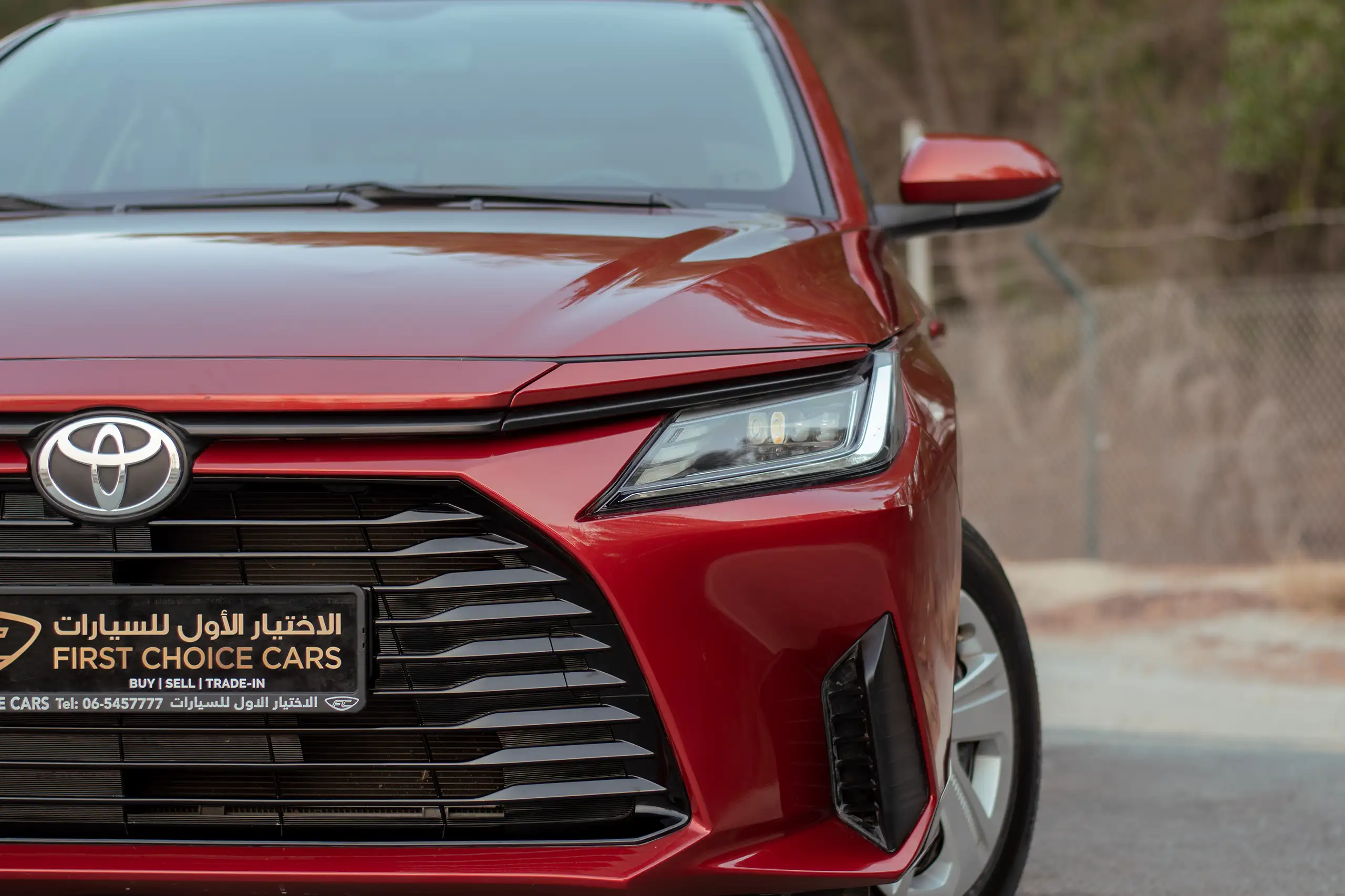 Used 2023 Toyota Yaris E Red – Headlight Close-up at First Choice Cars Sharjah