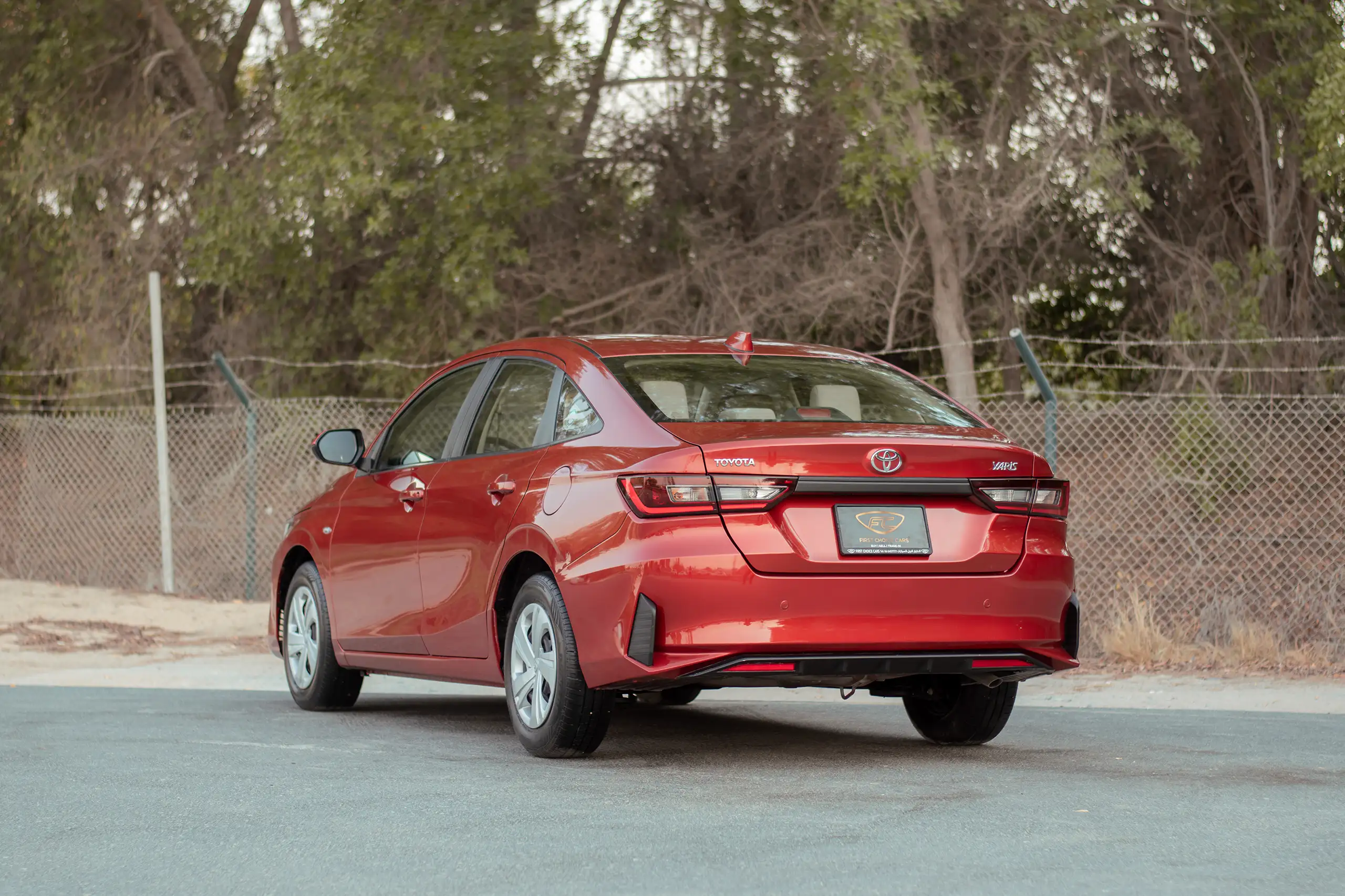 Used 2023 Toyota Yaris E Red – Left Back Diagonal (45°) View at First Choice Cars Sharjah