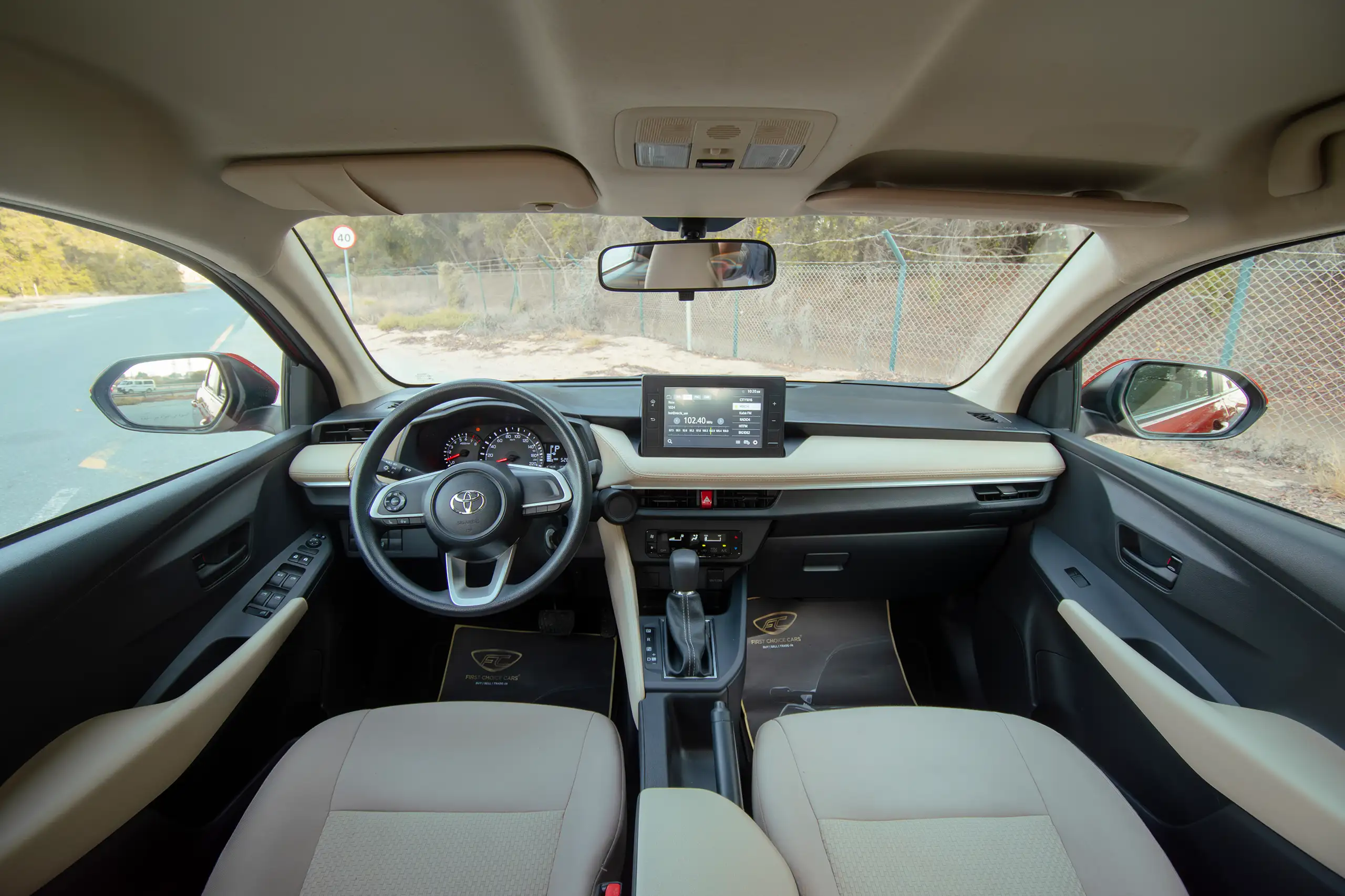 Used 2023 Toyota Yaris E Red – Front Cabin / Dashboard Full View at First Choice Cars Sharjah