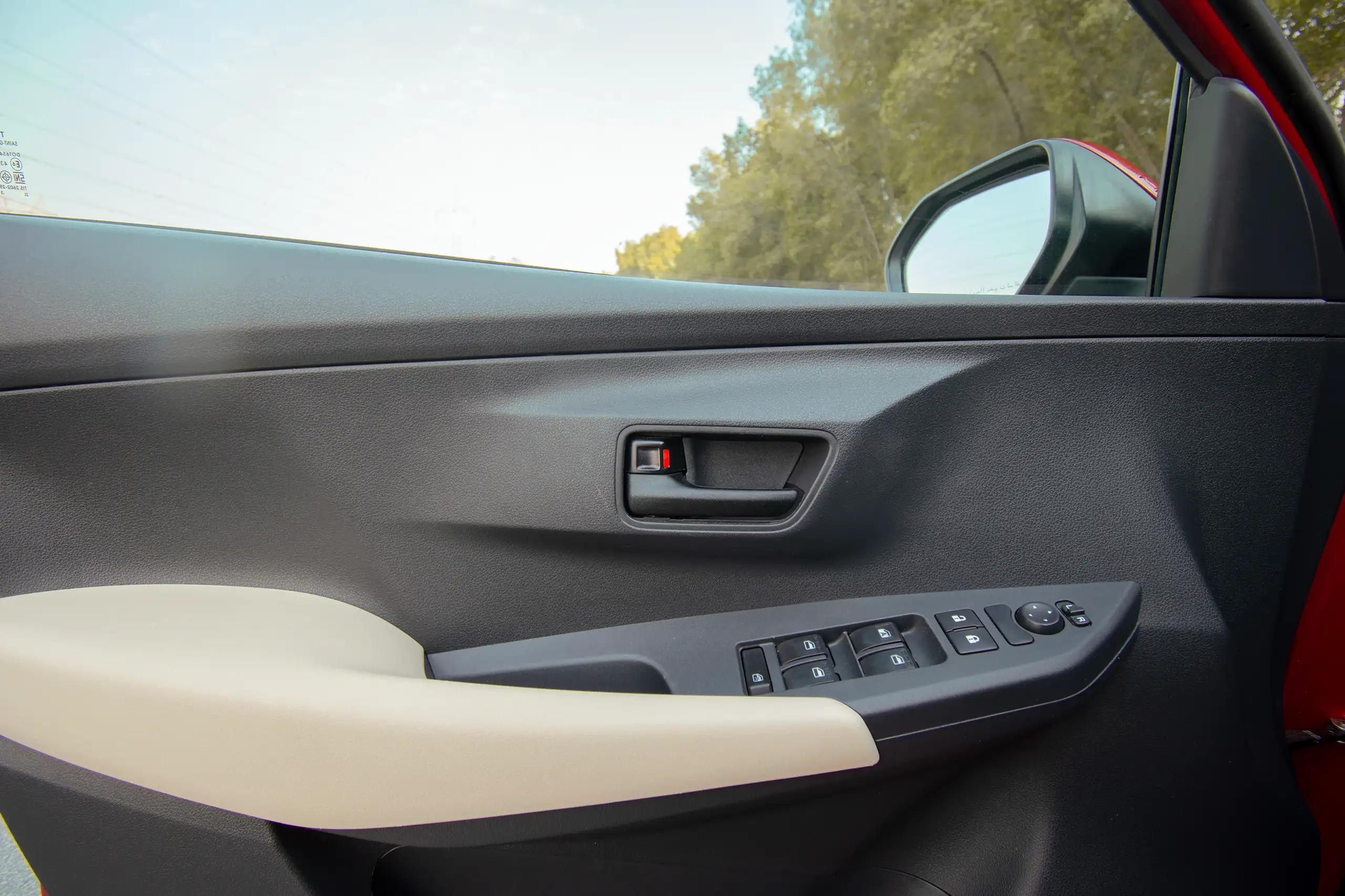 Used 2023 Toyota Yaris E Red – Driver Door Panel Full View at First Choice Cars Sharjah