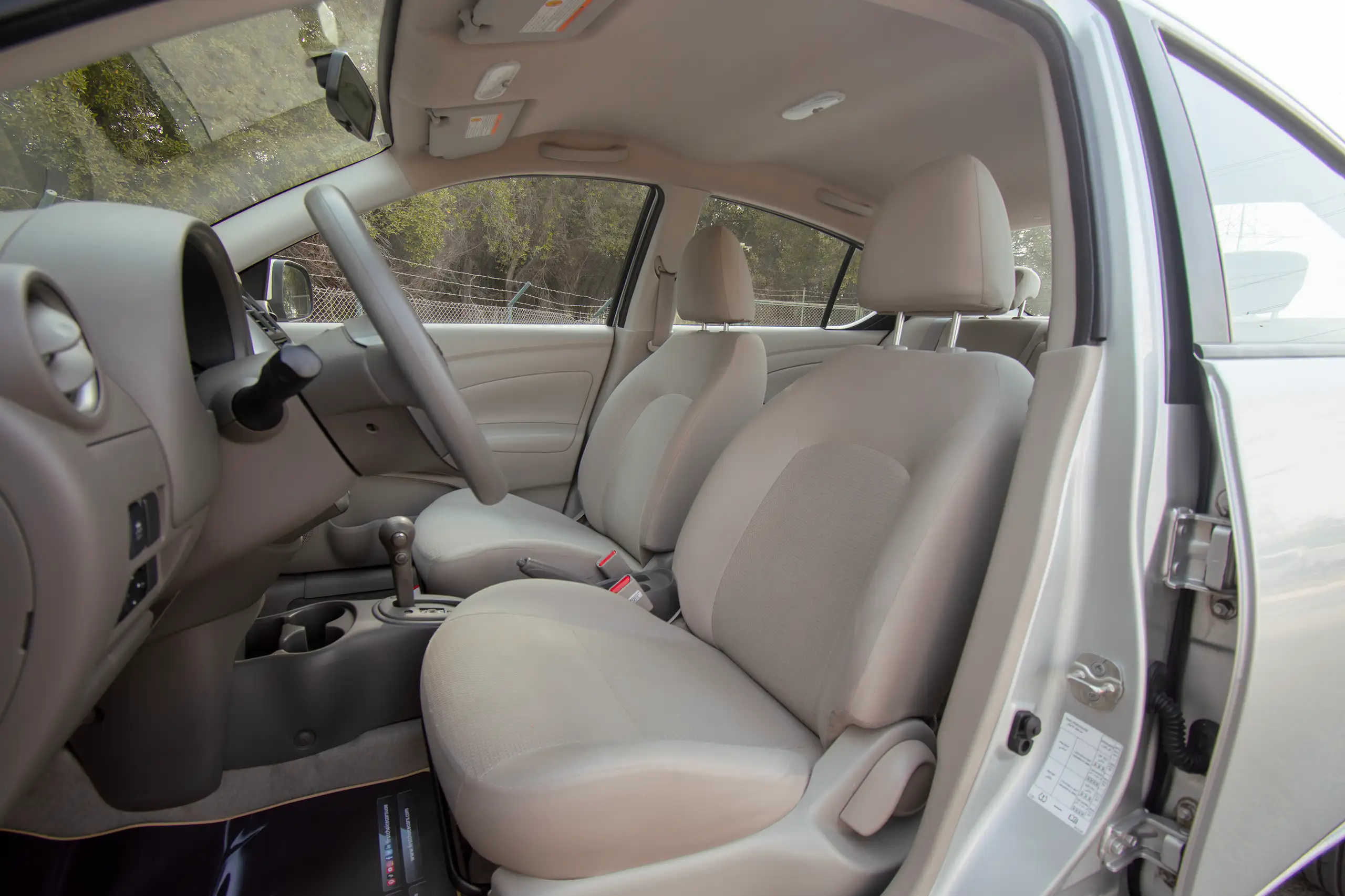 Used 2023 Nissan Sunny SV Silver – Front Driver Side Cabin View at First Choice Cars Sharjah