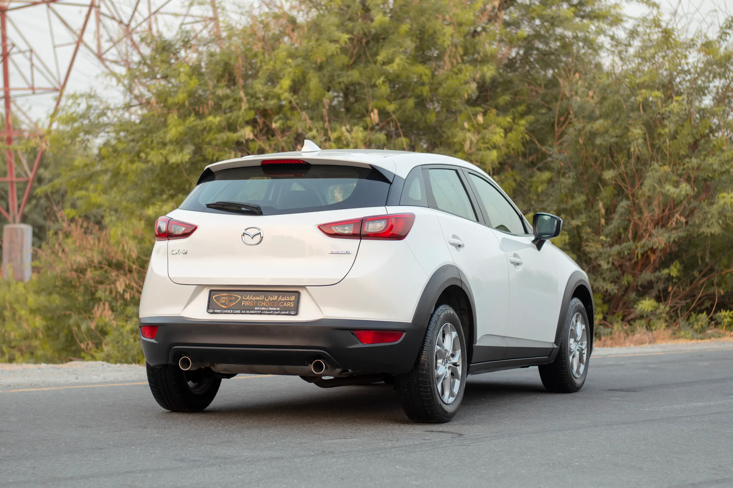 Used 2023 Mazda CX-3 Gs White – Rear Driver Side Cabin View at First Choice Cars Sharjah