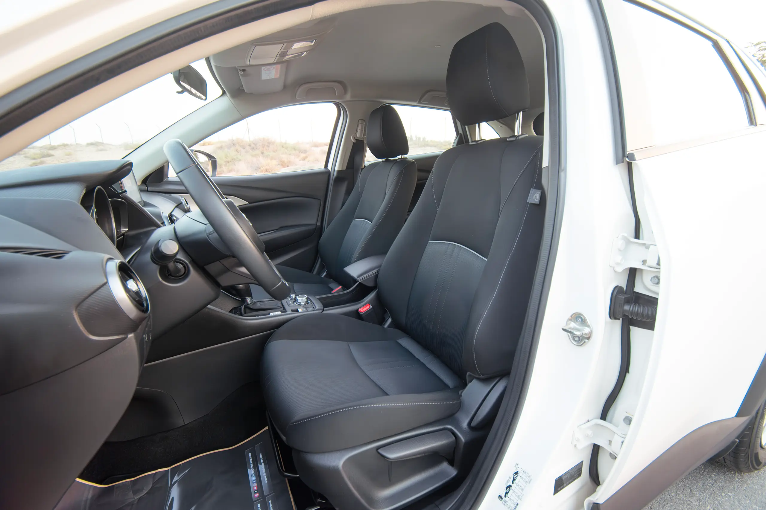 Used 2023 Mazda CX-3 Gs White – Front Driver Side Cabin View at First Choice Cars Sharjah