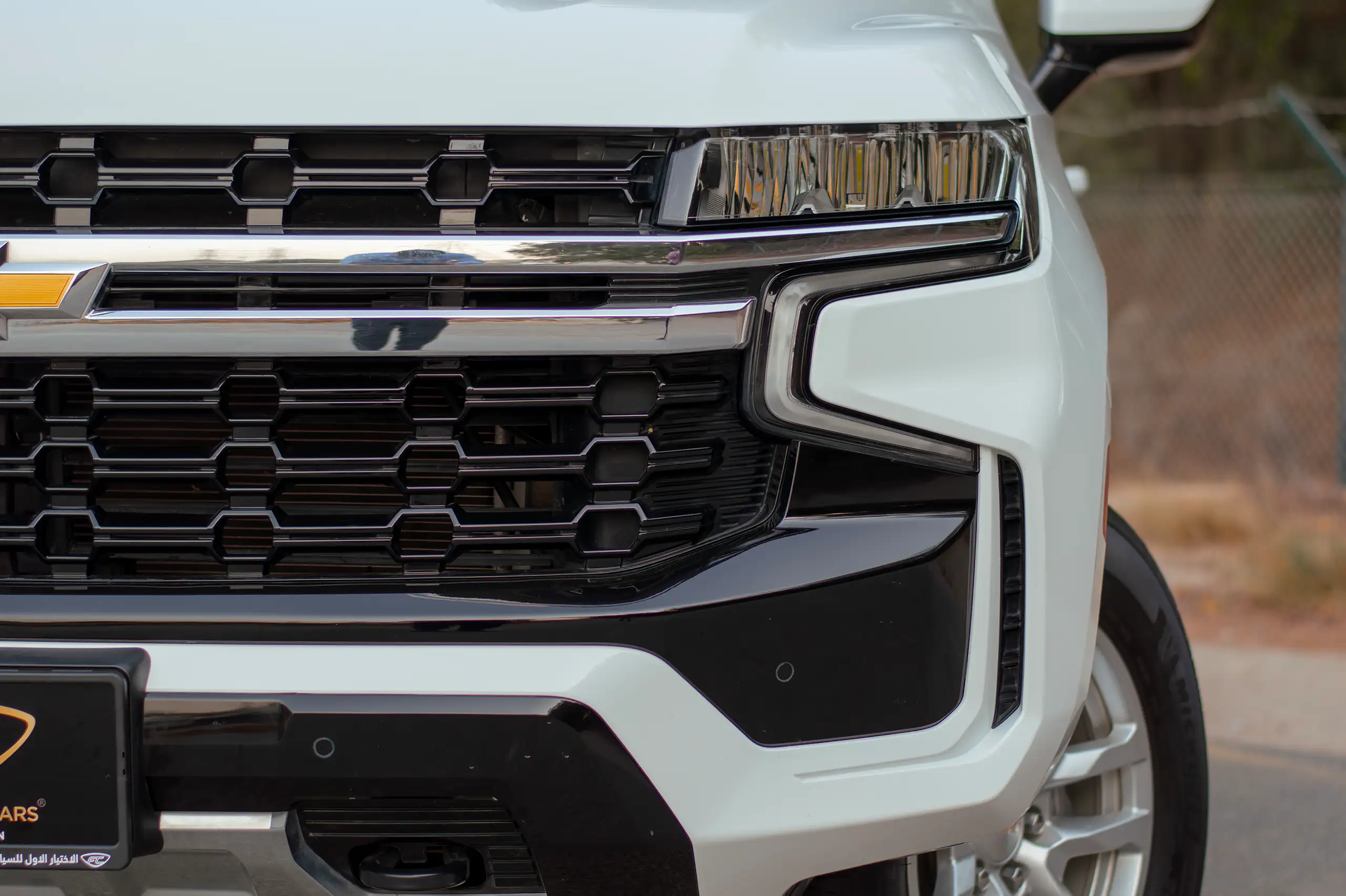Used 2023 Chevrolet Tahoe LS White – Headlight Close-up at First Choice Cars Sharjah