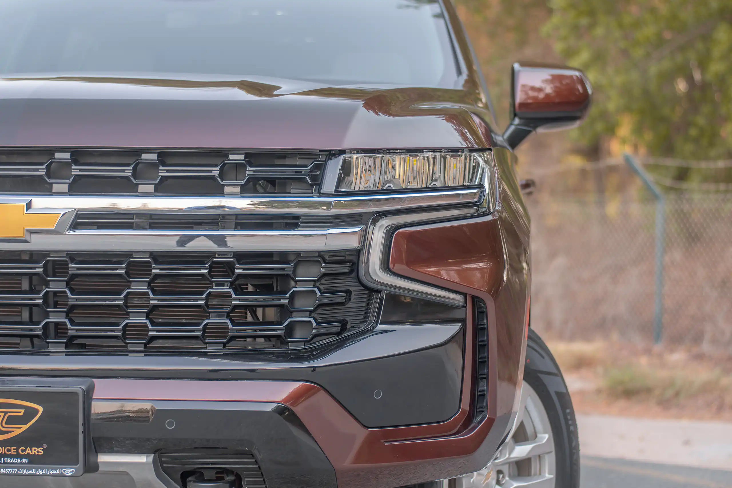 Used 2023 Chevrolet Tahoe LS Maroon – Headlight Close-up at First Choice Cars Sharjah