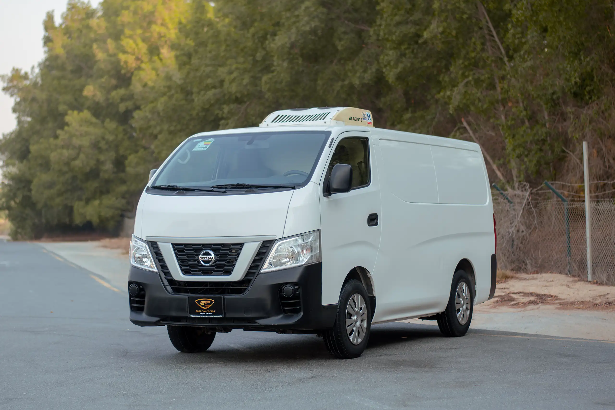 Used 2022 Nissan Urvan Standard Roof White – Left Front Diagonal (45°) View at First Choice Cars Sharjah
