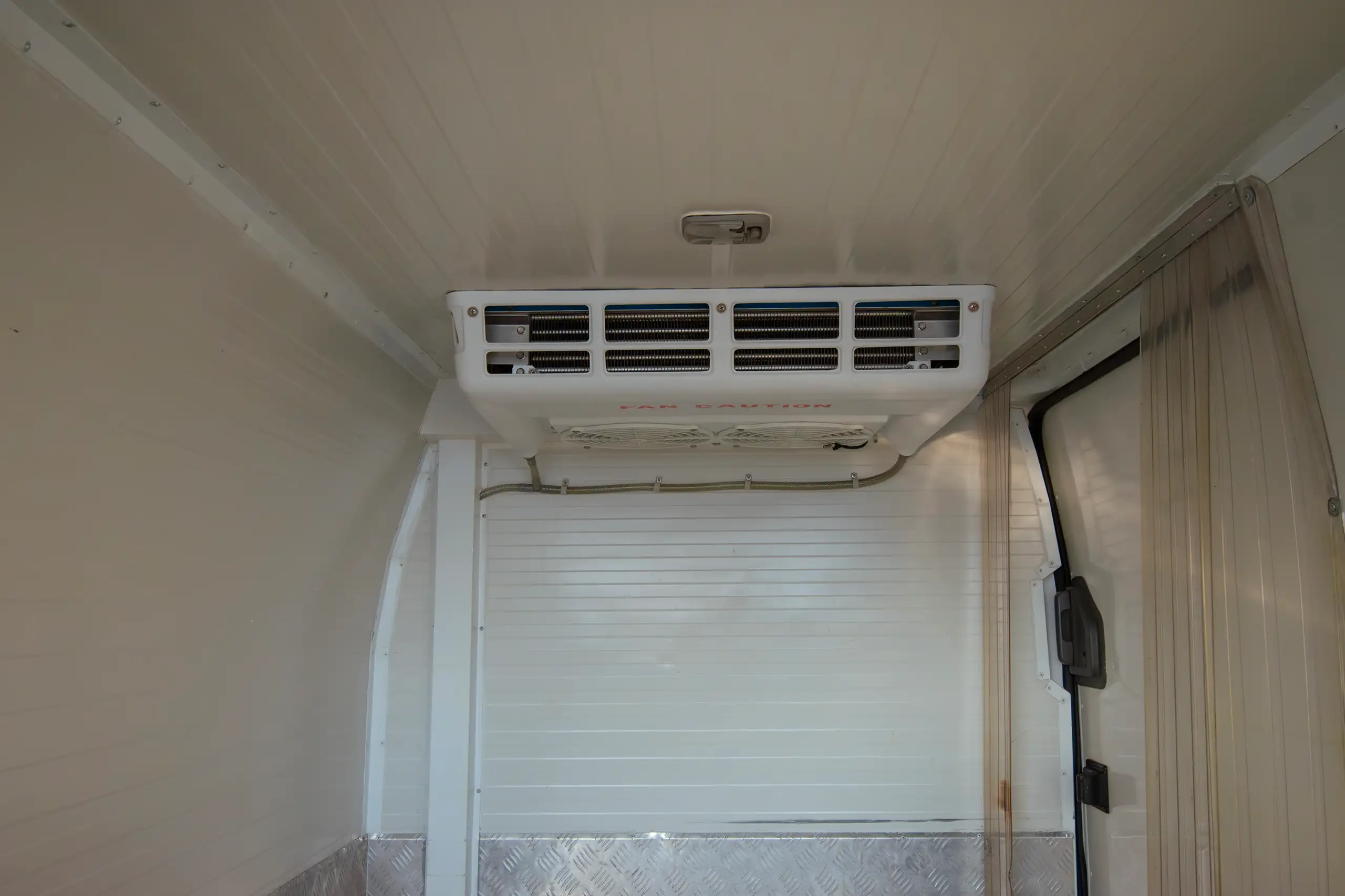 Used 2022 Nissan Urvan Standard Roof White – Chiller Cooling Unit View at First Choice Cars Sharjah