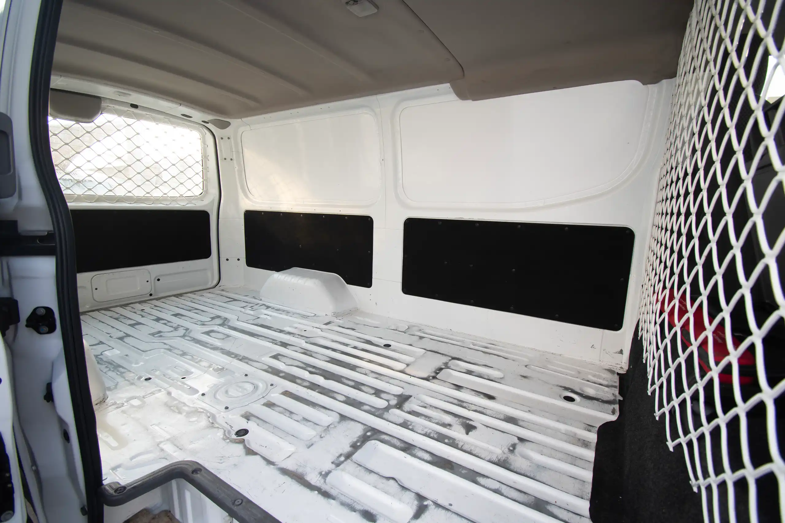 Used 2022 Nissan Urvan Standard Roof White – Delivery Box Right Side Interior View at First Choice Cars Sharjah