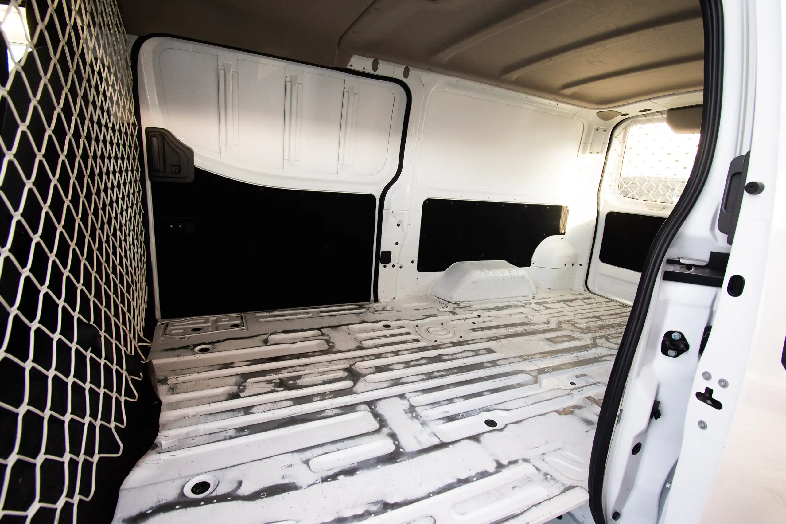 Used 2022 Nissan Urvan Standard Roof White – Delivery Box Right Side Interior View at First Choice Cars Sharjah