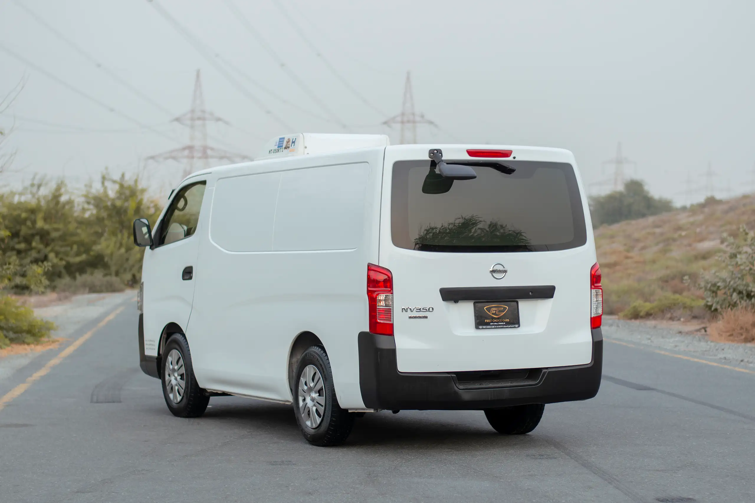 Used 2022 Nissan Urvan Standard Roof White – Left Back Diagonal (45°) View at First Choice Cars Sharjah