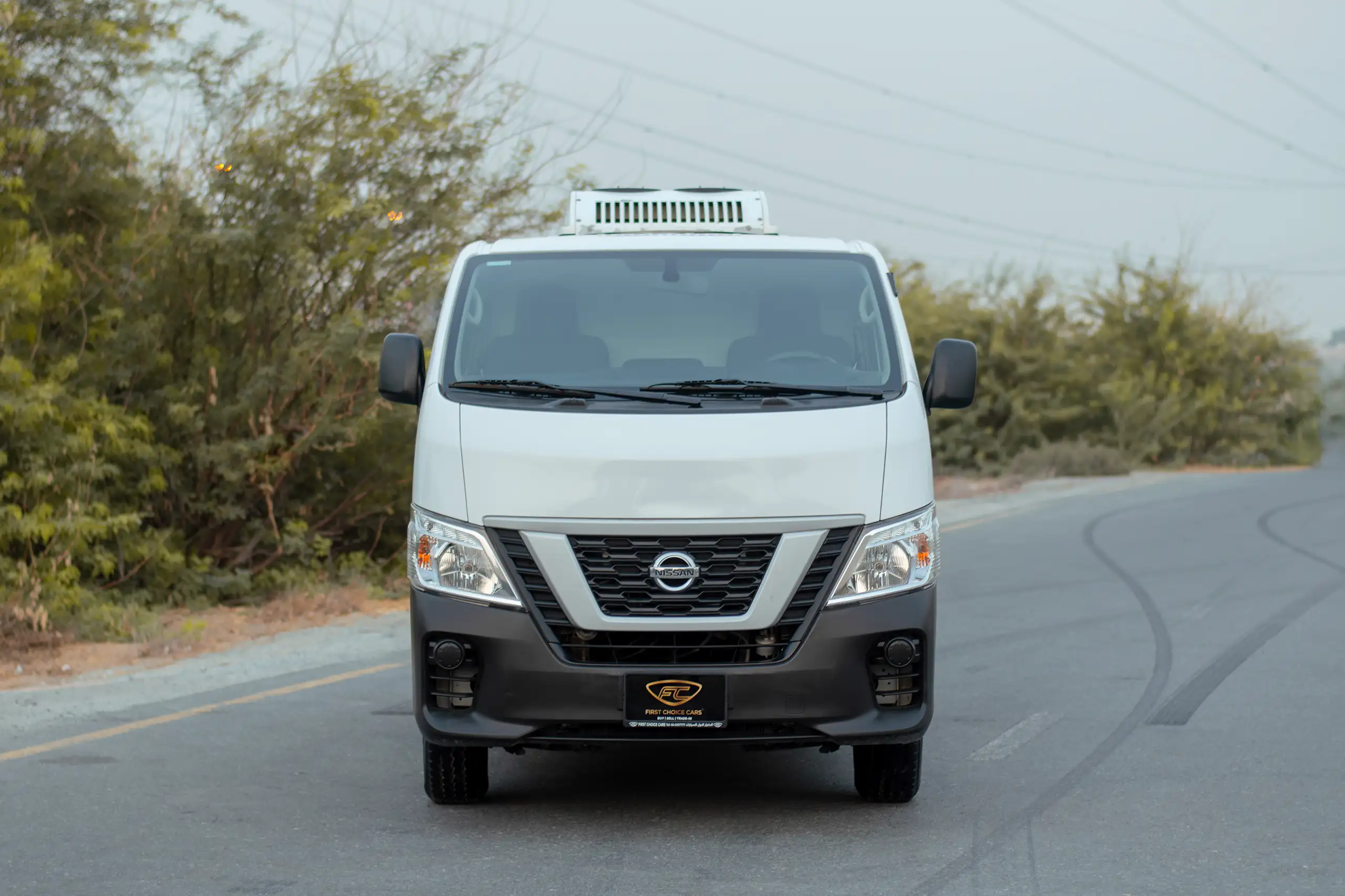 Used 2022 Nissan Urvan Standard Roof White – Front View at First Choice Cars Sharjah
