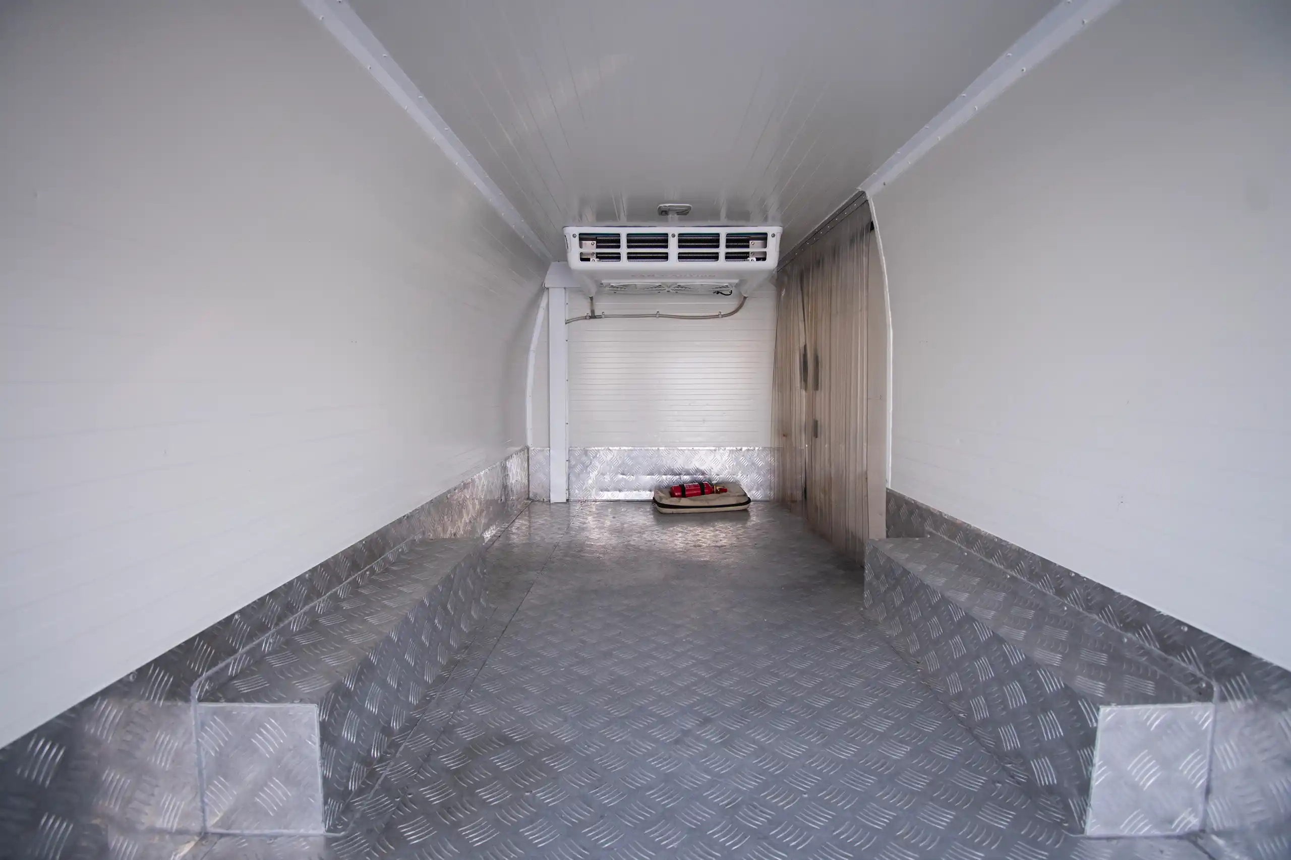 Used 2022 Nissan Urvan Standard Roof White – Chiller Box Rear Opening View at First Choice Cars Sharjah