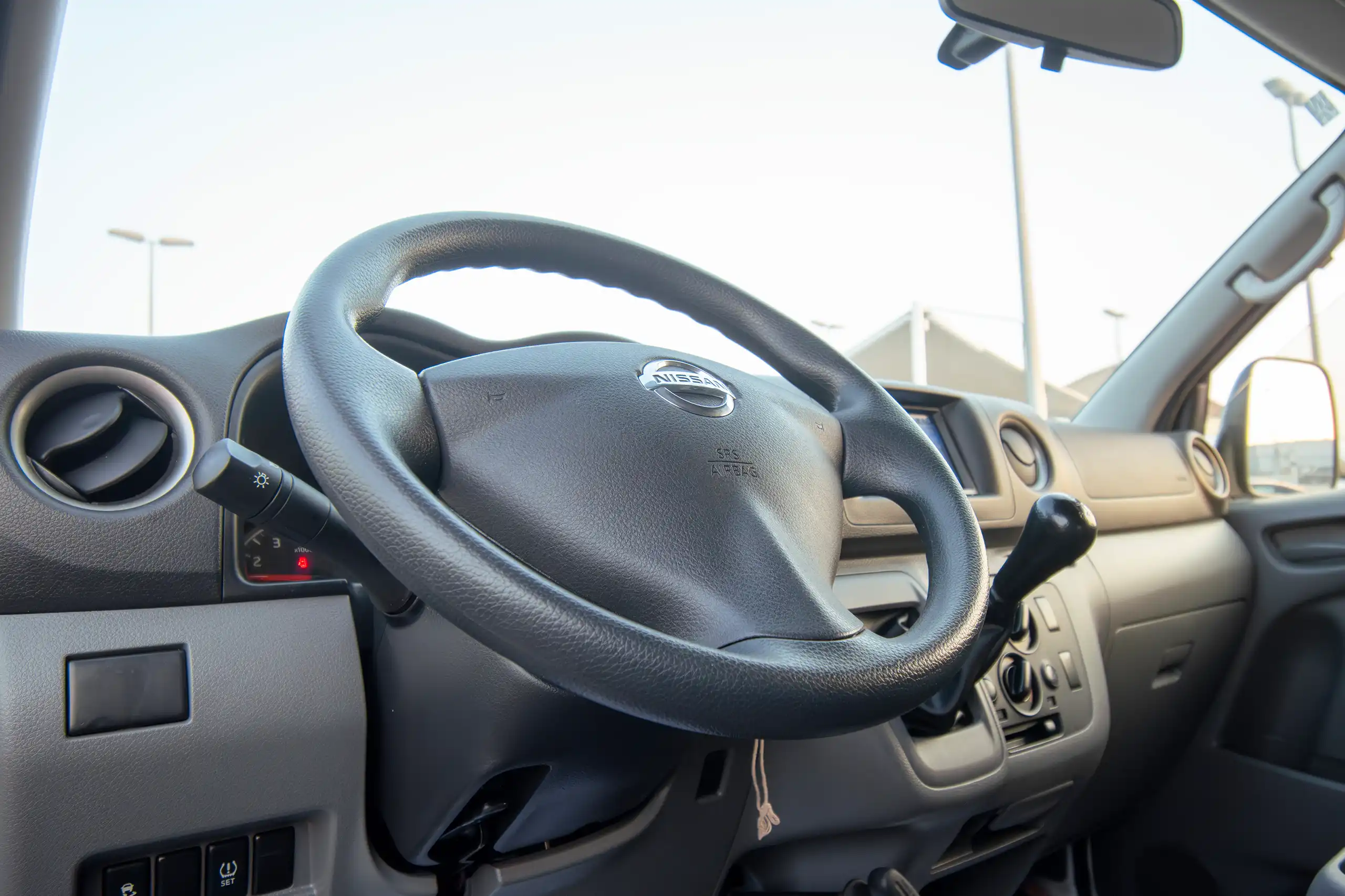 Used 2022 Nissan Urvan Standard Roof White – Driver Side Dashboard & Steering View at First Choice Cars Sharjah