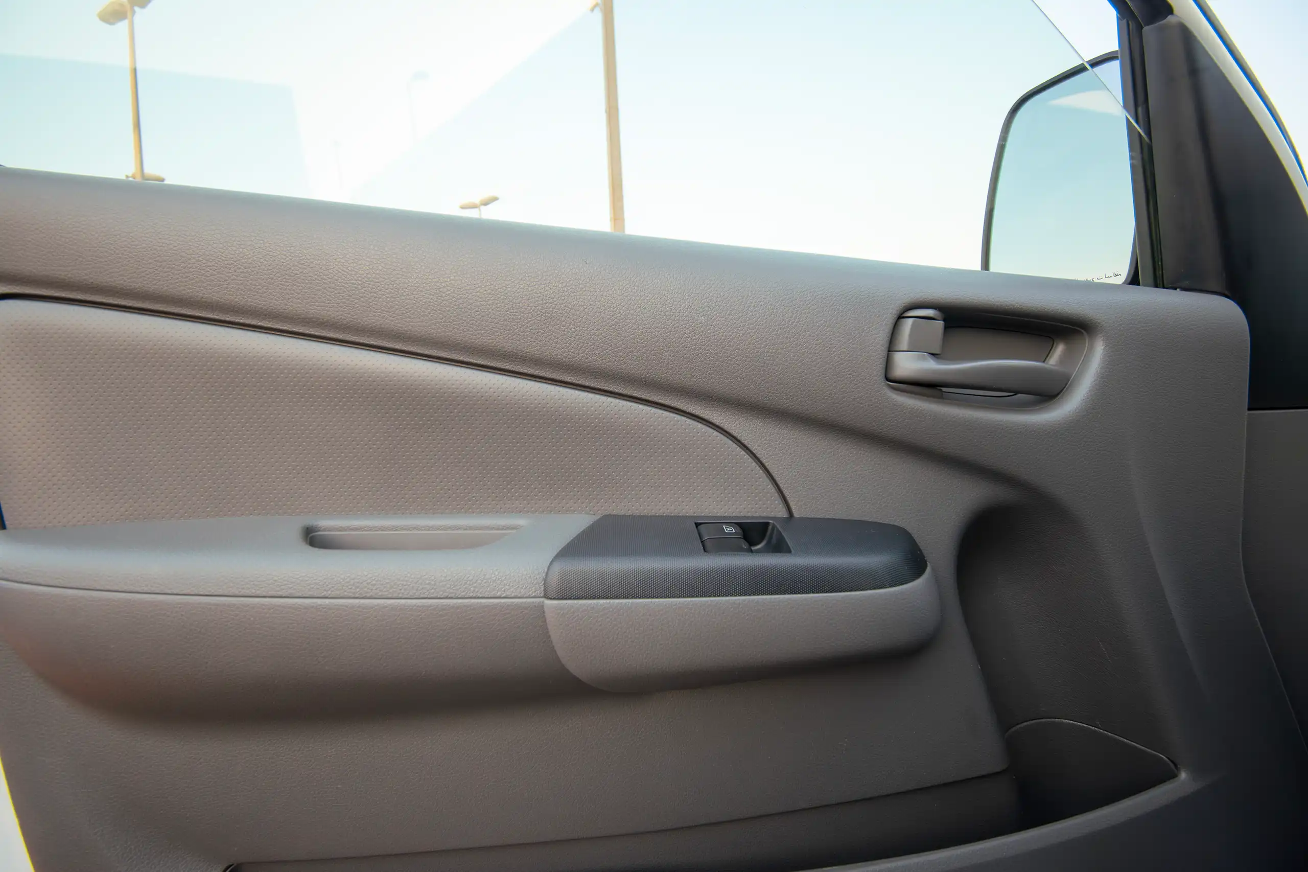 Used 2022 Nissan Urvan Standard Roof White – Driver Door Panel Full View at First Choice Cars Sharjah