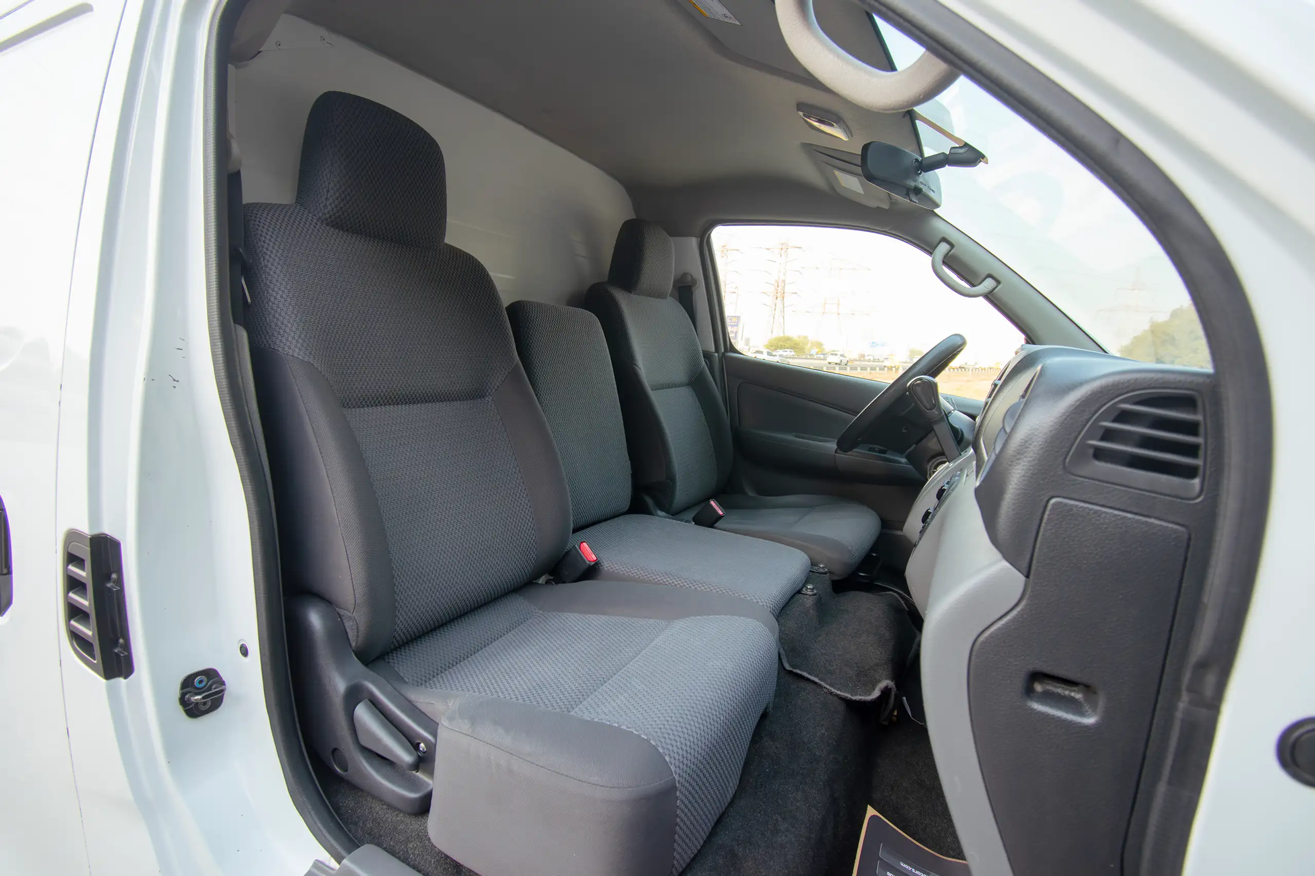 Used 2022 Nissan Urvan Standard Roof White – Front Passenger Side Cabin View at First Choice Cars Sharjah
