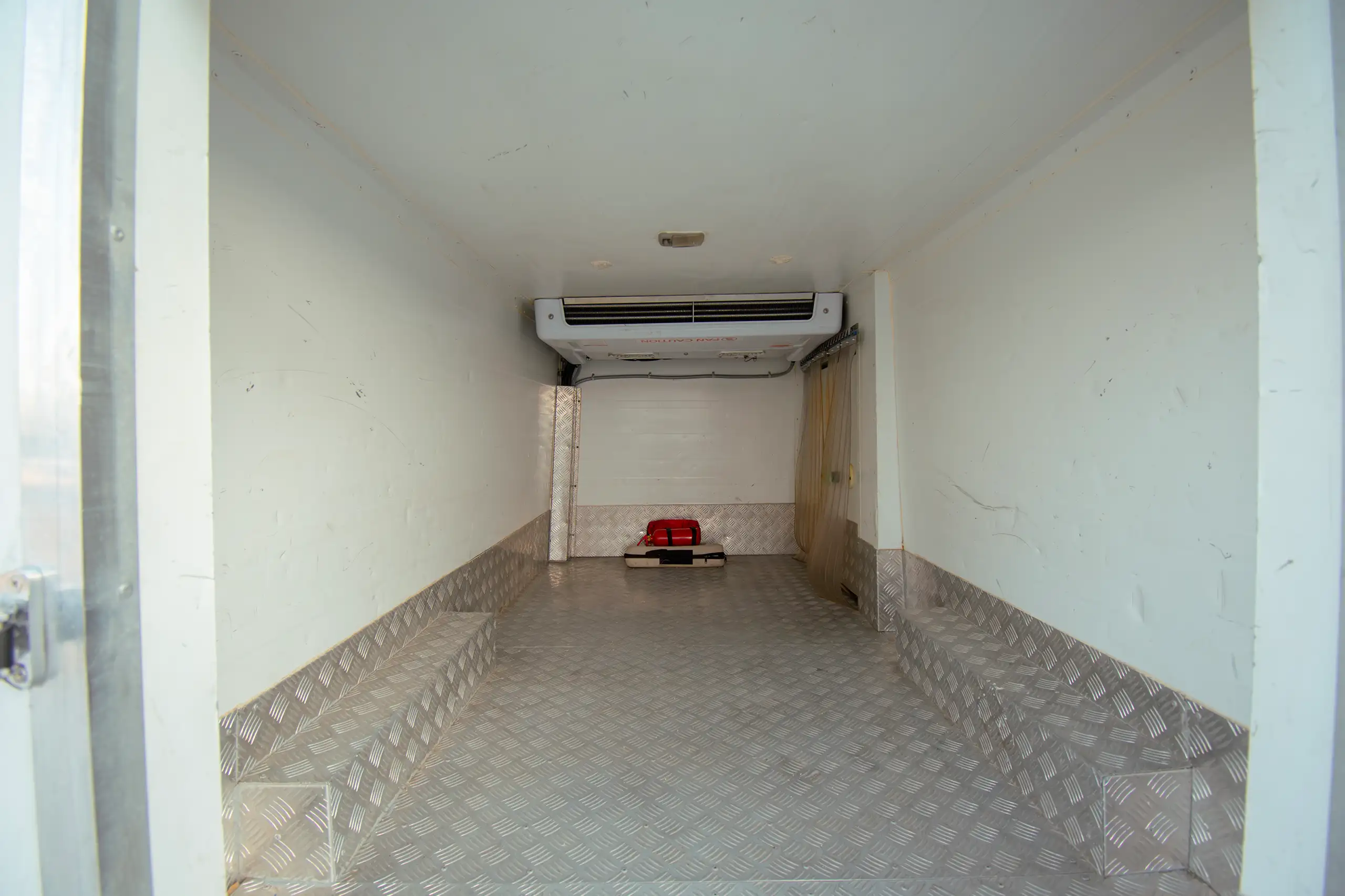 Used 2022 Nissan Urvan Standard Roof White – Freezer Box Rear Opening View at First Choice Cars Sharjah