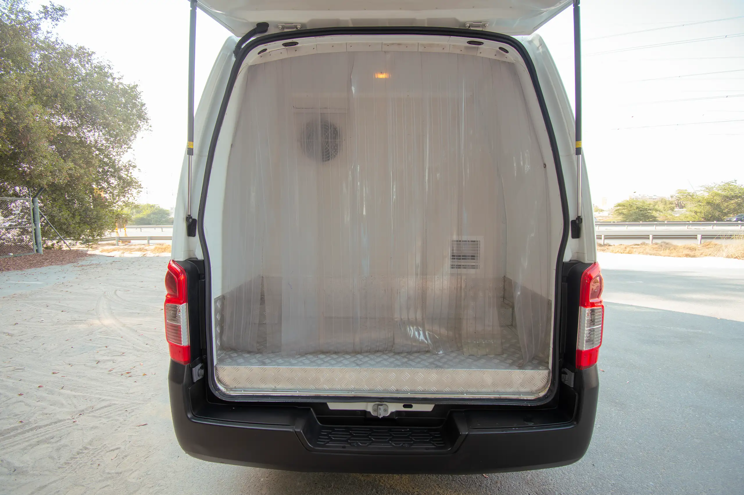 Used 2022 Nissan Urvan High Roof White – Cargo Bed Rear-to-Front View at First Choice Cars Sharjah