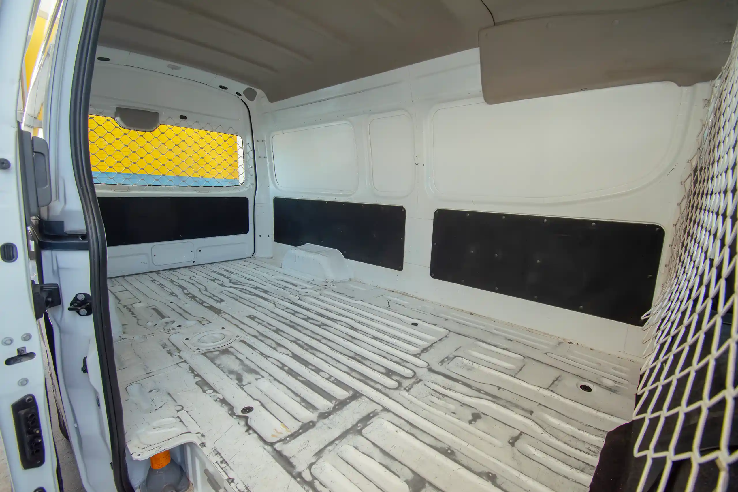 Used 2022 Nissan Urvan High Roof White – Delivery Box Right Side Interior View at First Choice Cars Sharjah