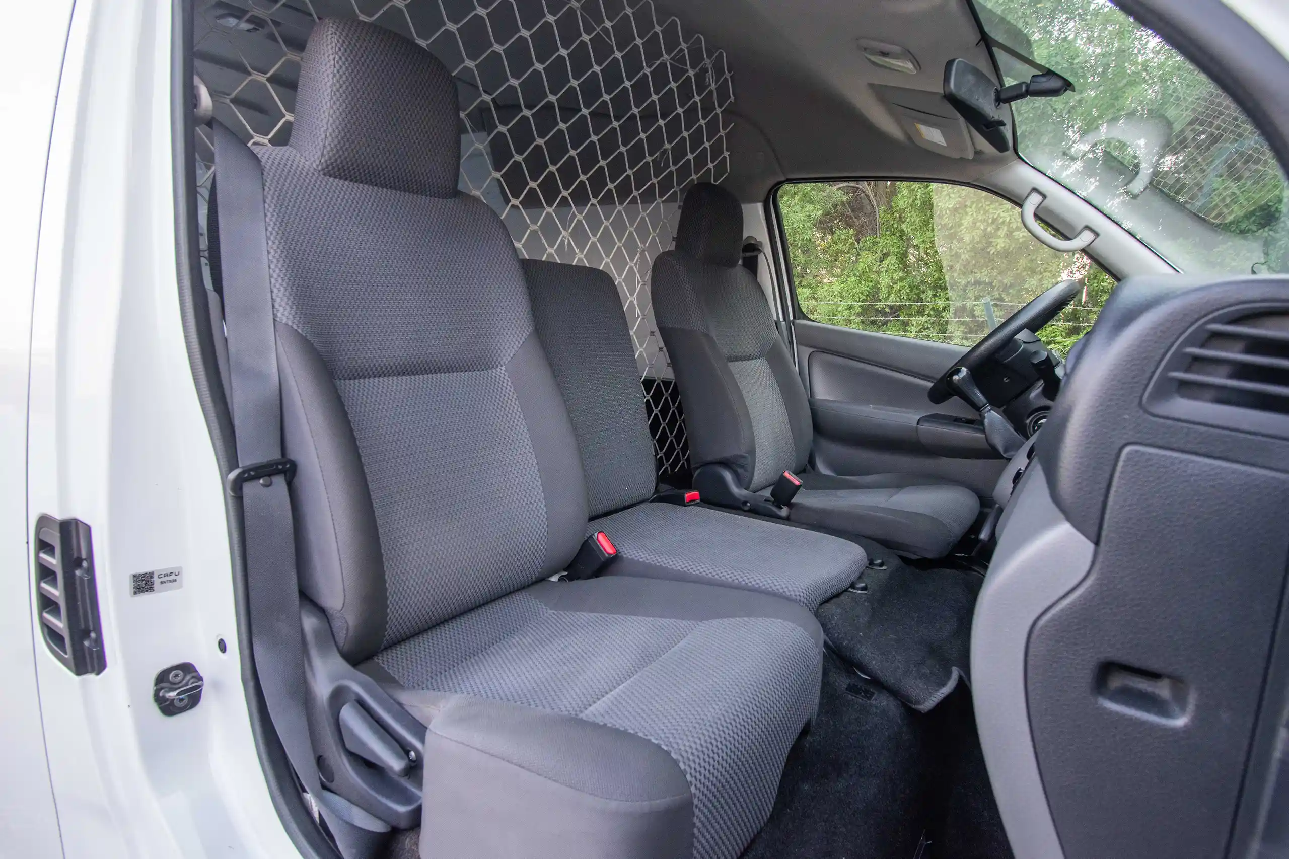 Used 2022 Nissan Urvan High Roof White – Front Passenger Side Cabin View at First Choice Cars Sharjah